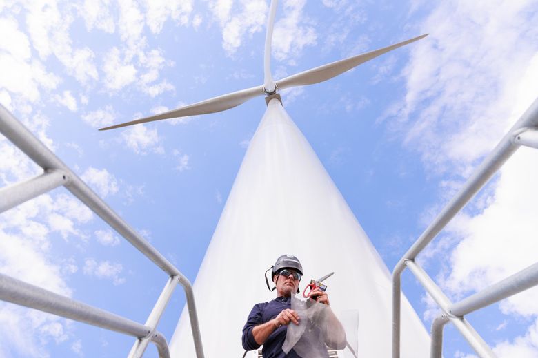 Turbine inspector Robert Shoemaker, with RLS Renewables, works on mouse mitigation and inspections at Beaver Creek. (Erika Schultz / The Seattle Times)