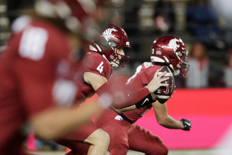 Washington State quarterback Zevi Eckhaus (4) receives a snap during the second half of an NCAA college football game against Oregon State, Saturday, Nov. 29, 2025, in Pullman, Wash. (Young Kwak / The Associated Press)