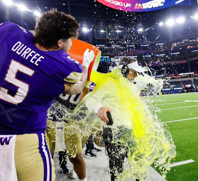 Huskies coach Jedd Fisch gets doused with the Gatorade after Washington defeated Boise State 38-10 in the Bucked Up LA Bowl, hosted by Gronk, on Saturday at SoFi Stadium, in Inglewood, Calif. (Dean Rutz / The Seattle Times)