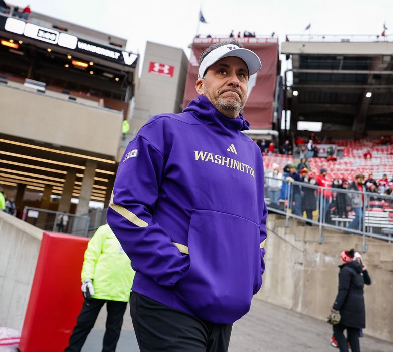 Washington coach Jedd Fisch walks on to the turf before a game against Wisconsin, Nov. 8, 2025, at Camp Randall Stadium, in Madison, Wis. (Dean Rutz / The Seattle Times)