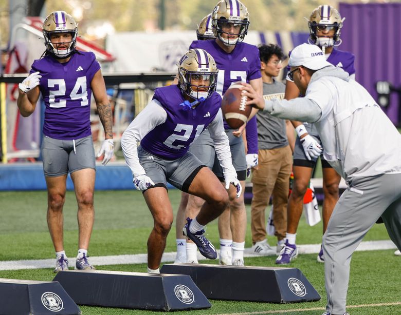 Dyson McCutcheon (21), working in a preseason drill, has announced he’ll enter the transfer portal. (Dean Rutz / The Seattle Times)