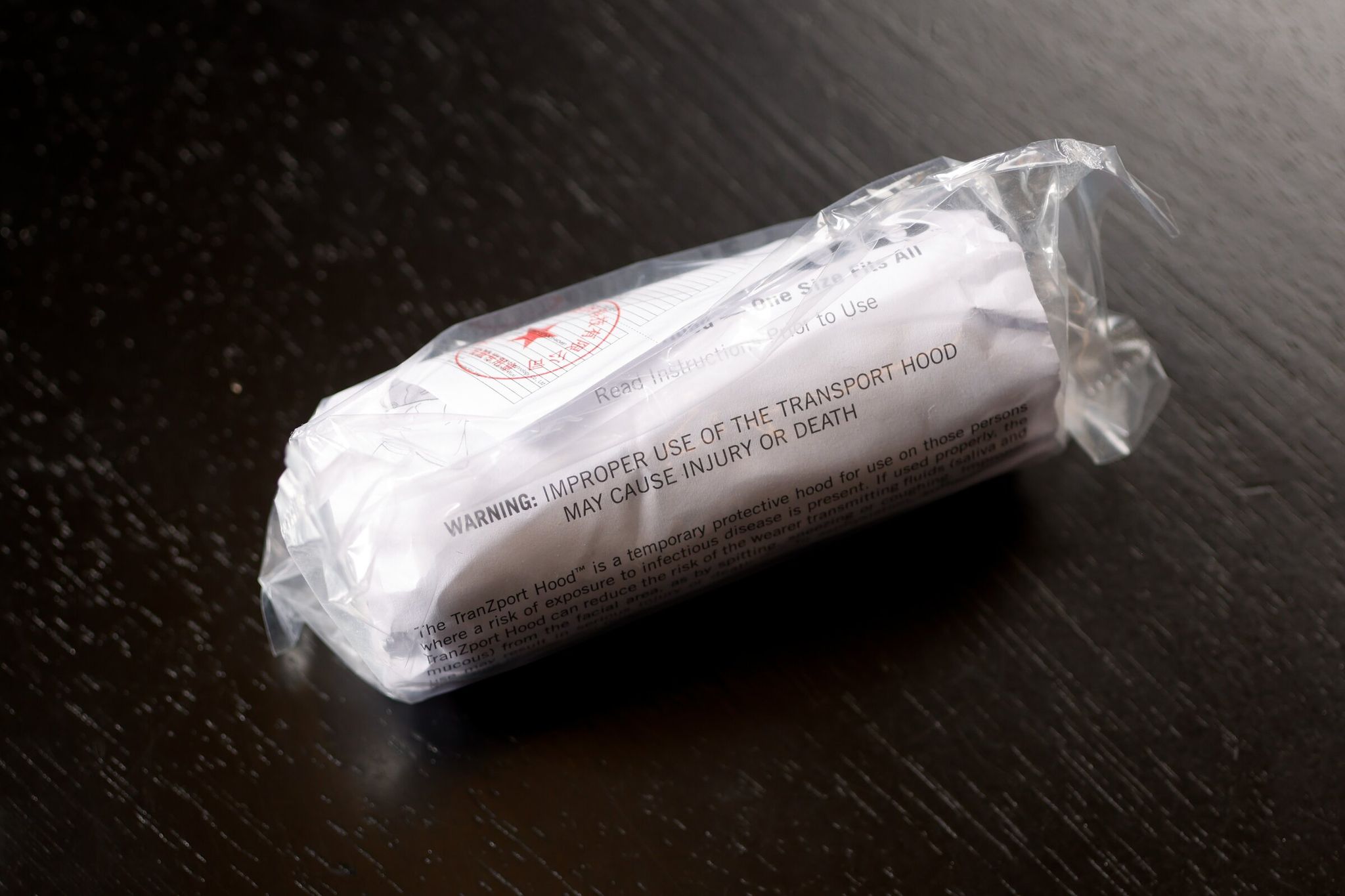 A warning on the packaging of a TranZport spit hood reads that improper use of the product ‘may result in injury or death.’ (Karen Ducey / The Seattle Times)