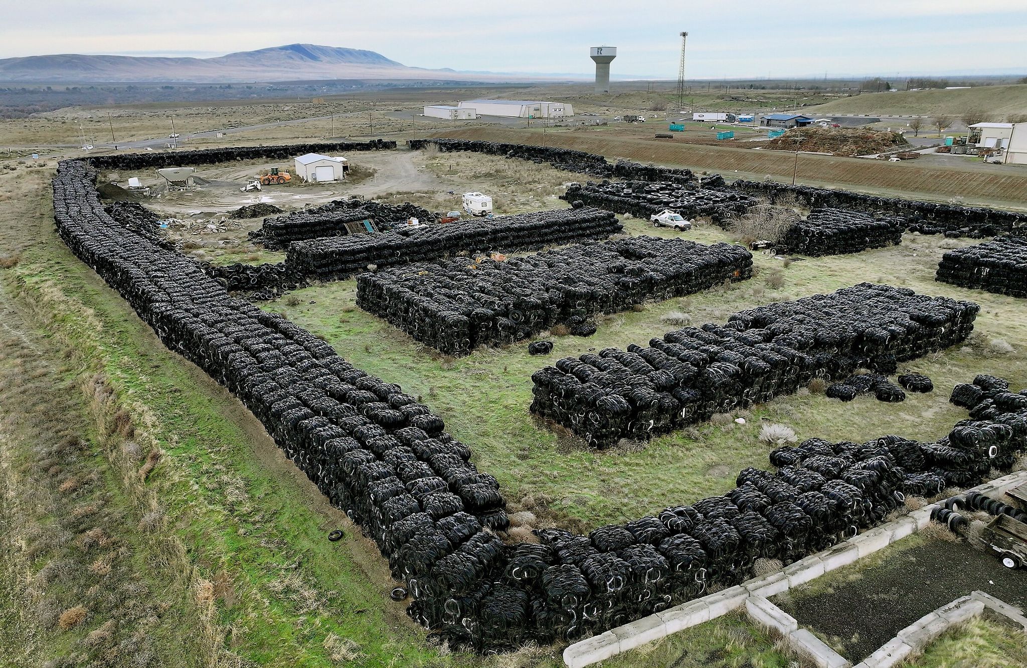 The Washington State Department of Ecology estimates about 7,100 tons of tires are on this Twin Bridges Road site in Richland. Tri-Cities lawmakers say they secured $3.2 million to remove the old tire stockpiles. (Bob Brawdy / Tri-City Herald)
