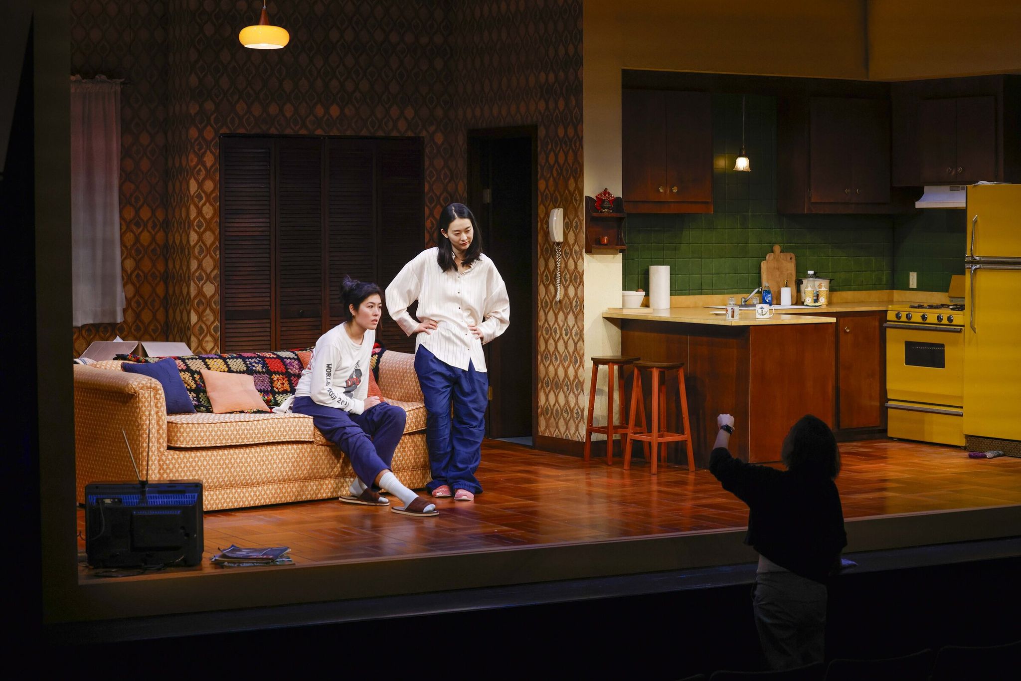 Left to right actors Becca Q. Co, who plays Luna; Seoyoung Park, who plays Jane; and director Sunam Ellis share a moment during a rehearsal of 'The Heart Sellers.' (Ivy Ceballo / The Seattle Times)