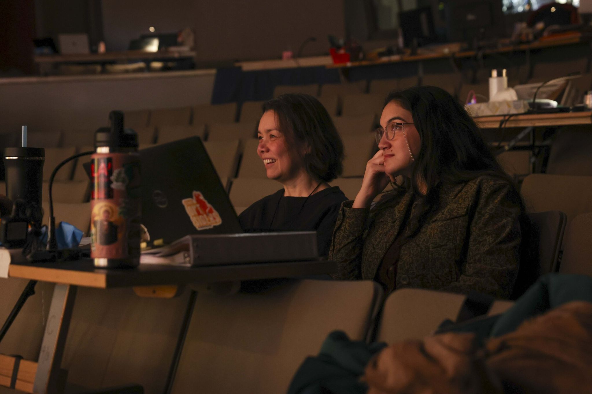 Director Sunam Ellis (left) and apprentice in directing and artistic programs Jaina Shoda Meyer observe a technical rehearsal. (Ivy Ceballo / The Seattle Times)