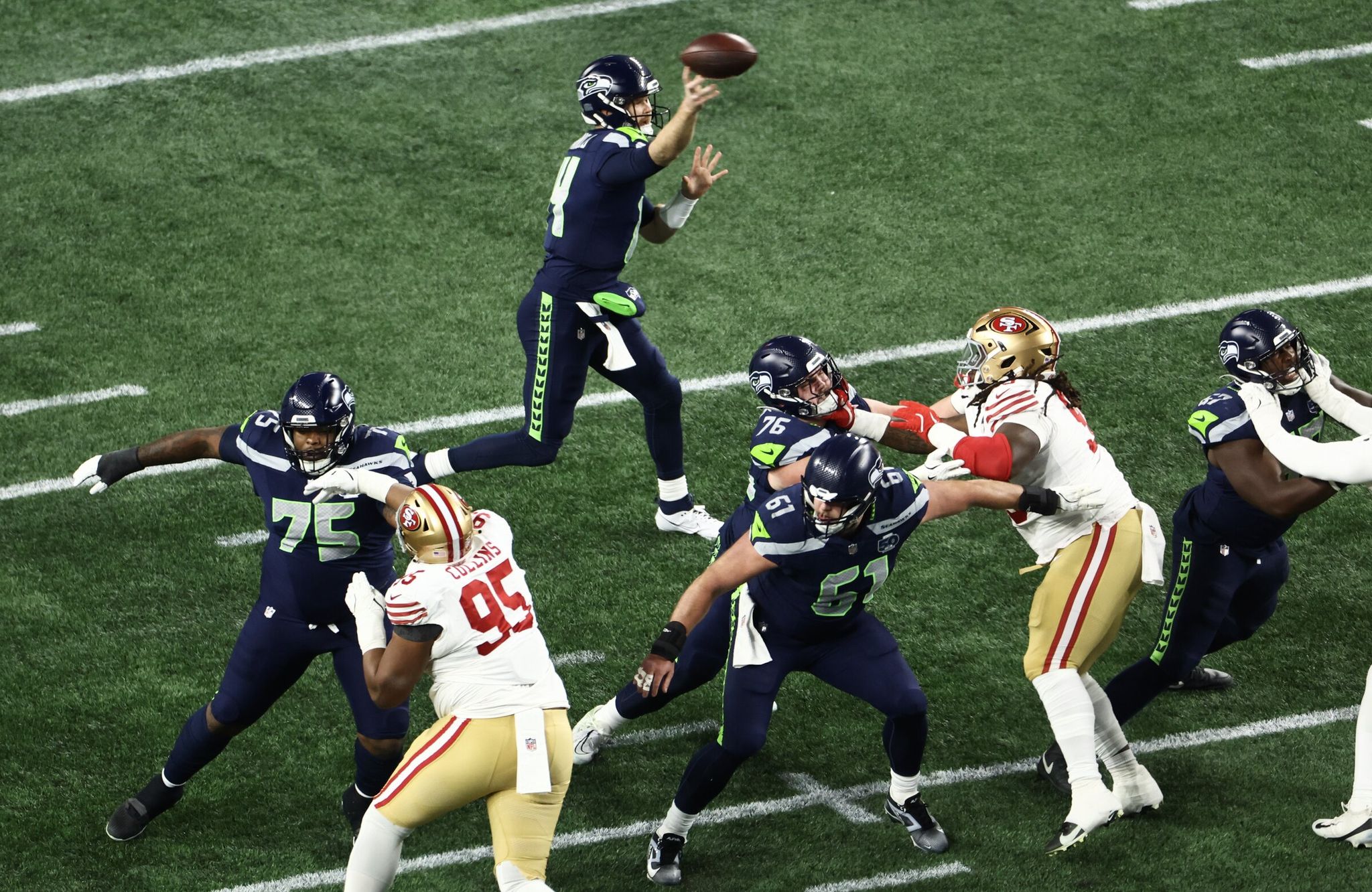 Seahawks quarterback Sam Darnold (14) throws the ball during the NFL divisional playoff game against the 49ers on Saturday. (Nick Wagner / The Seattle Times)