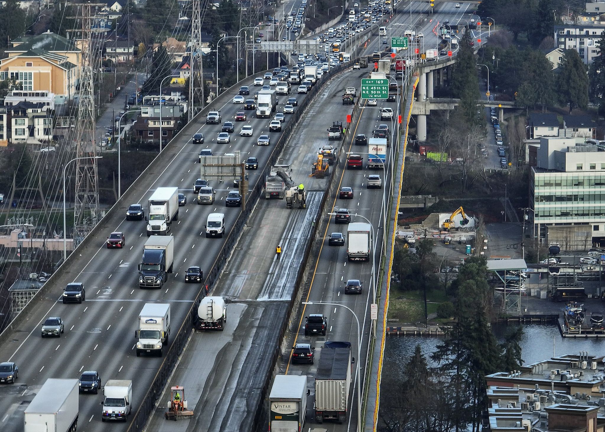 A view north shows traffic moving on both sides of major work on the deck of the Ship Canal Bridge, taken from the air on Thursday, Jan. 22, 2026, in Seattle. Southbound lanes are on the left. (Ken Lambert / The Seattle Times)