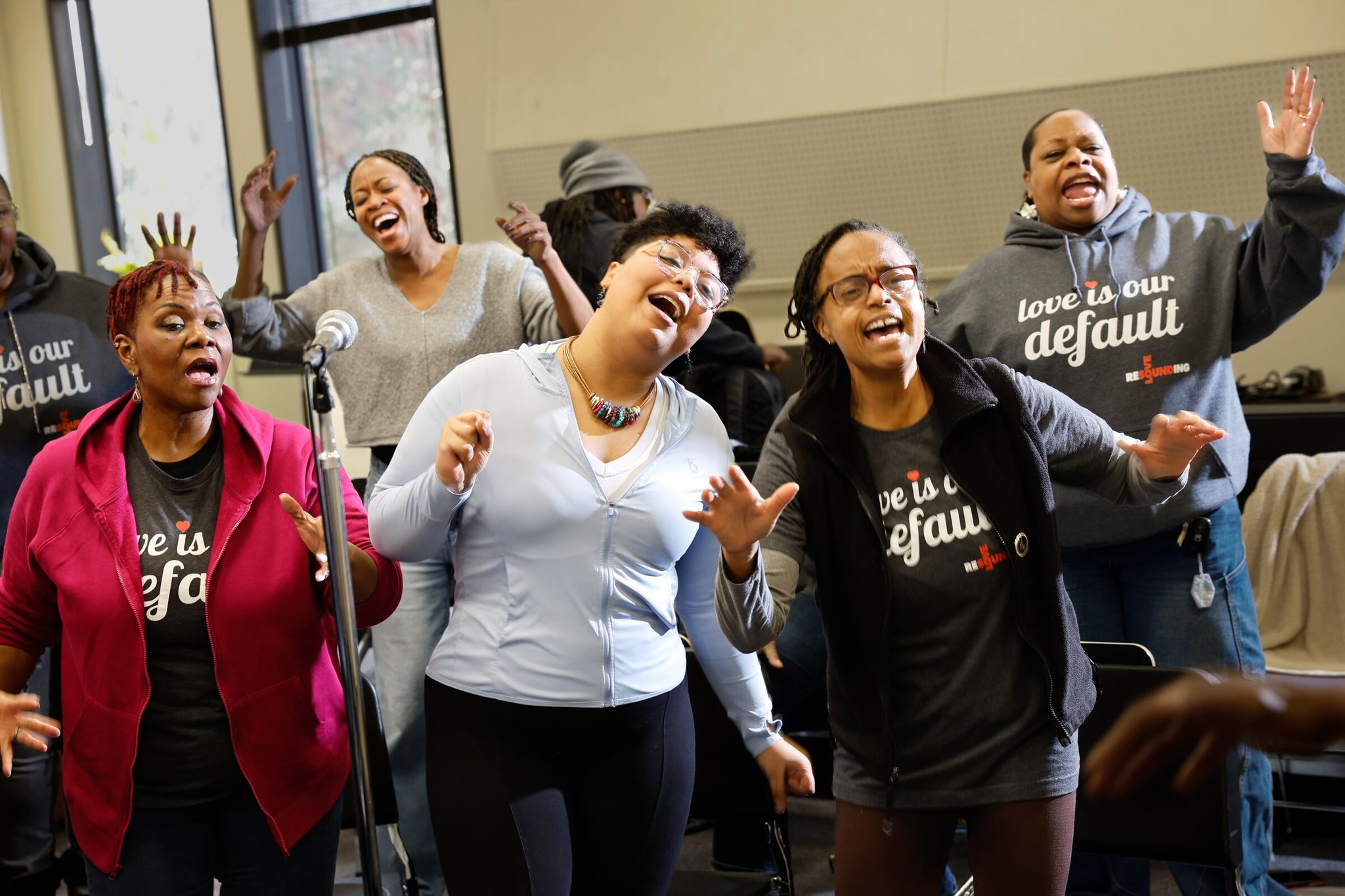 The soprano section of Resounding Love sings during rehearsal at South Seattle College on Saturday. Left to right, back row: Stacey Smith and Janine Mori. Front row left to right: Michelle Edwards, Melody Echavarria and Karen Smith Fraser. (Karen Ducey / The Seattle Times)