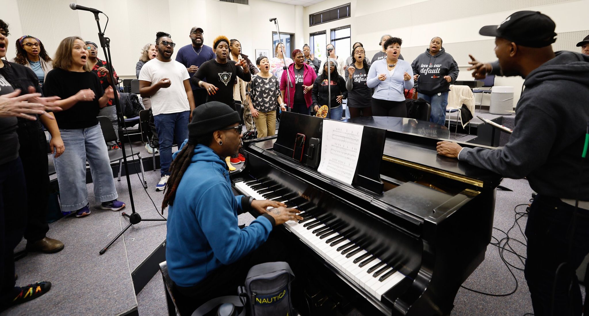 Resounding Love, a multiracial, interfaith choir open to LGBTQ+ people, rehearsed Saturday at South Seattle College in preparation for a February concert. (Karen Ducey / The Seattle Times)
