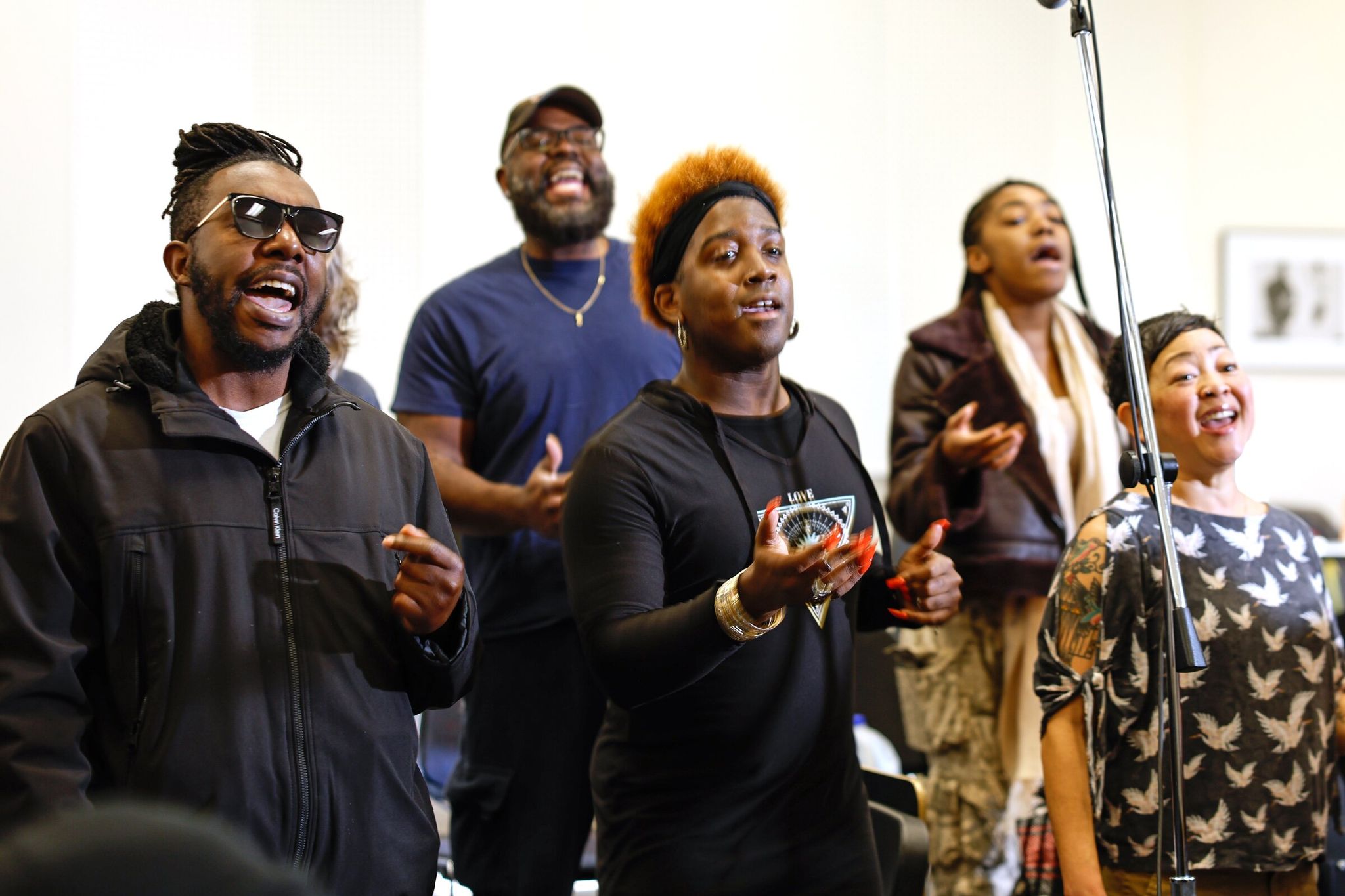 The tenor section of Resounding Love, including Jabari Jones (left), Cory Klein (back row), Trey 'Blu' Adams (center), Jada Sills (right rear) and Cindy Ogasawara, rehearses at South Seattle College on Saturday. (Karen Ducey / The Seattle Times)