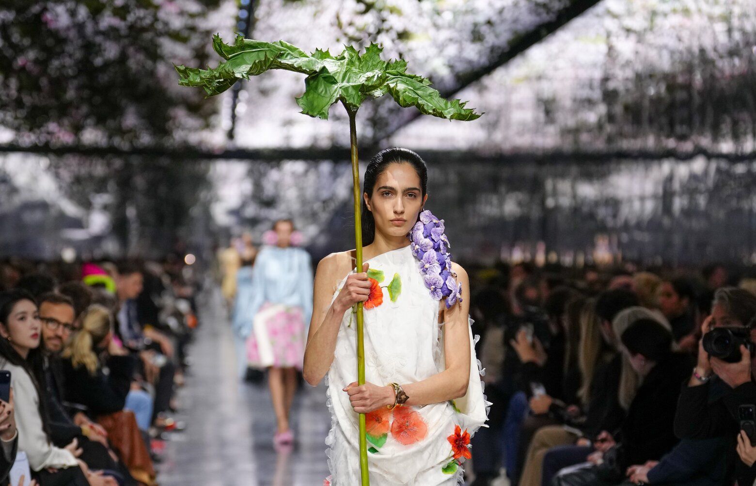Pondering a parasol at the Christian Dior fashion show | The