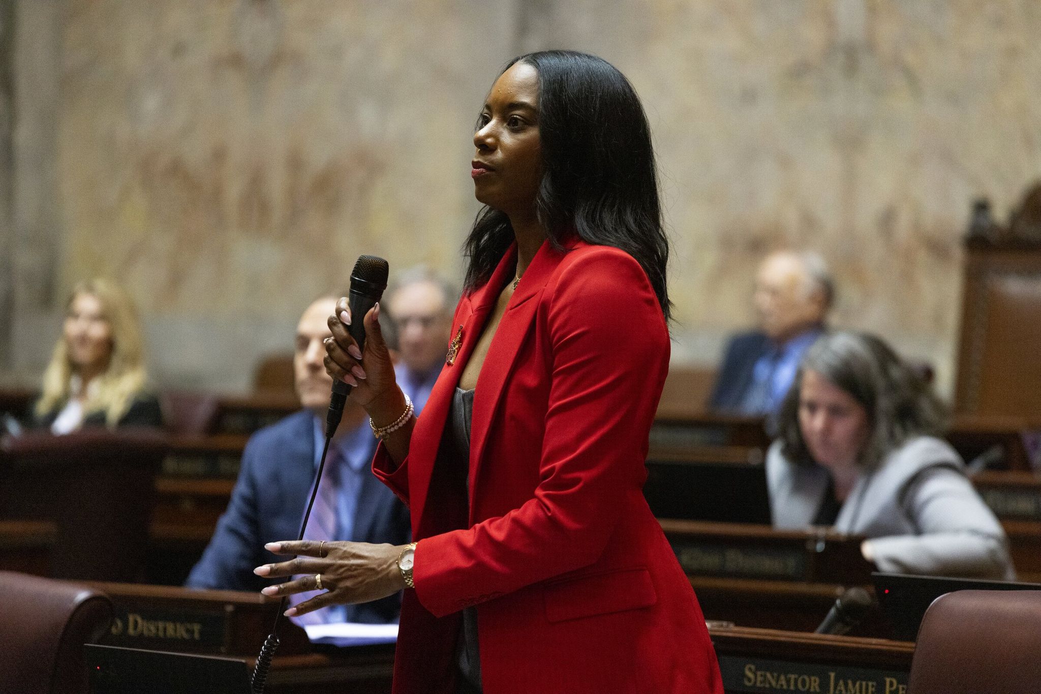 Assistant Senate Majority Leader T'wina Nobles, a Democrat from Fircrest, rises to speak on opening day of the 2025 legislative session in Olympia. (Ken Lambert / The Seattle Times)