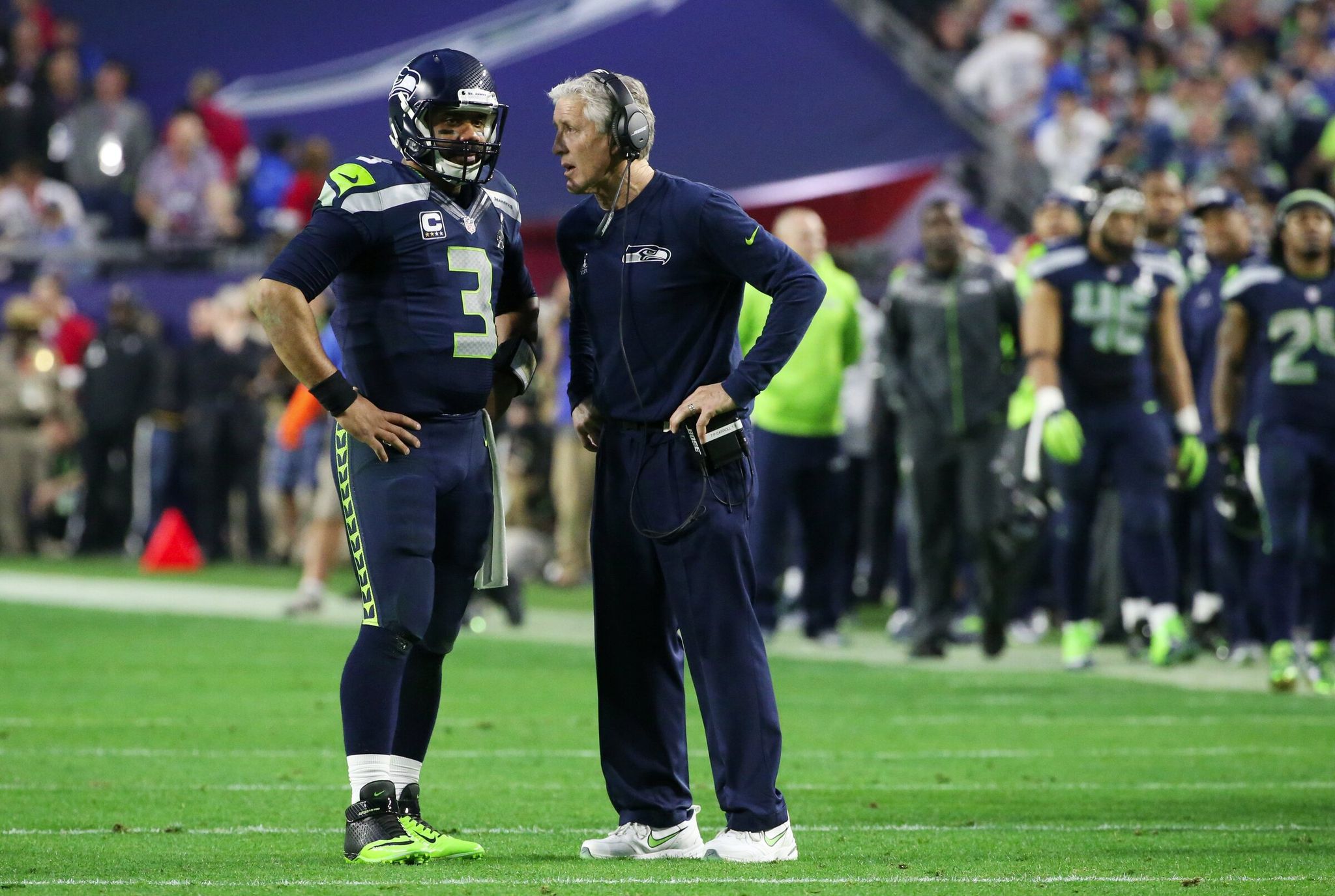 Seahawks quarterback Russell Wilson talks with coach Pete Carroll shortly before scoring to tie the game 14-14 late in the second quarter of Super Bowl XLIX in Glendale, Ariz., Feb. 1, 2015. (Bettina Hansen / The Seattle Times)