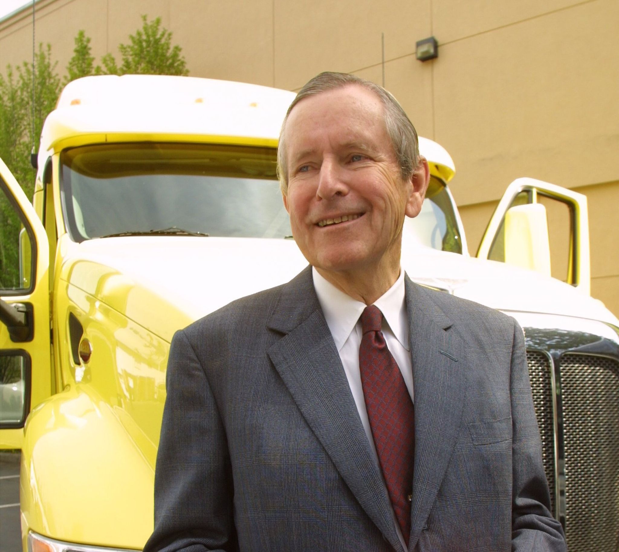 Charles M. Pigott stands in front of a Peterbilt truck, one of several heavy-truck brands made by Paccar, in 2001. He died Jan. 21 at age 96. (Greg Gilbert / The Seattle Times)