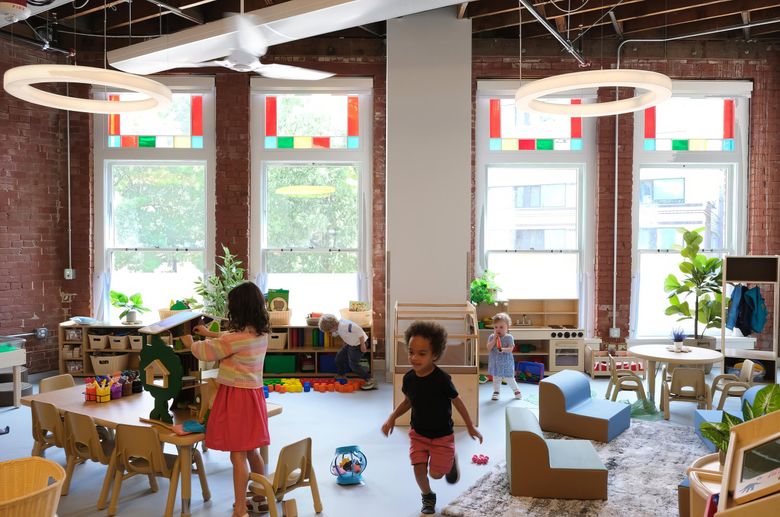 NOW: Childcare for staffers of resident organizations is provided by Seed of Life. The facility features five light-filled classrooms that preserve the structure’s historic character, including exposed brick walls. (Jean Sherrard)