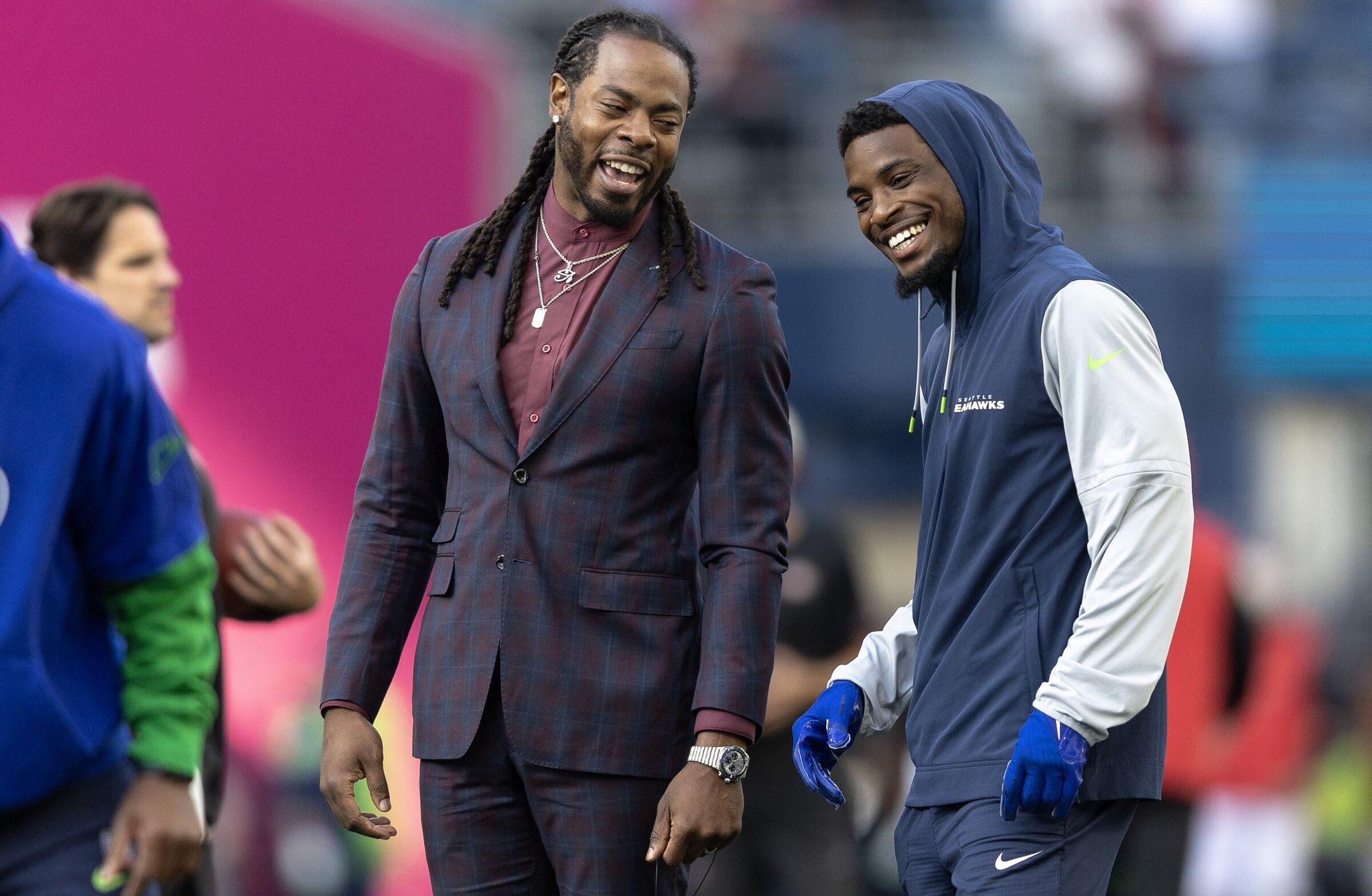 Former Seahawks cornerback Richard Sherman laughs with current Seahawks corner Devon Weatherspoon before a Thursday night game last season. (Nick Wagner / The Seattle Times)