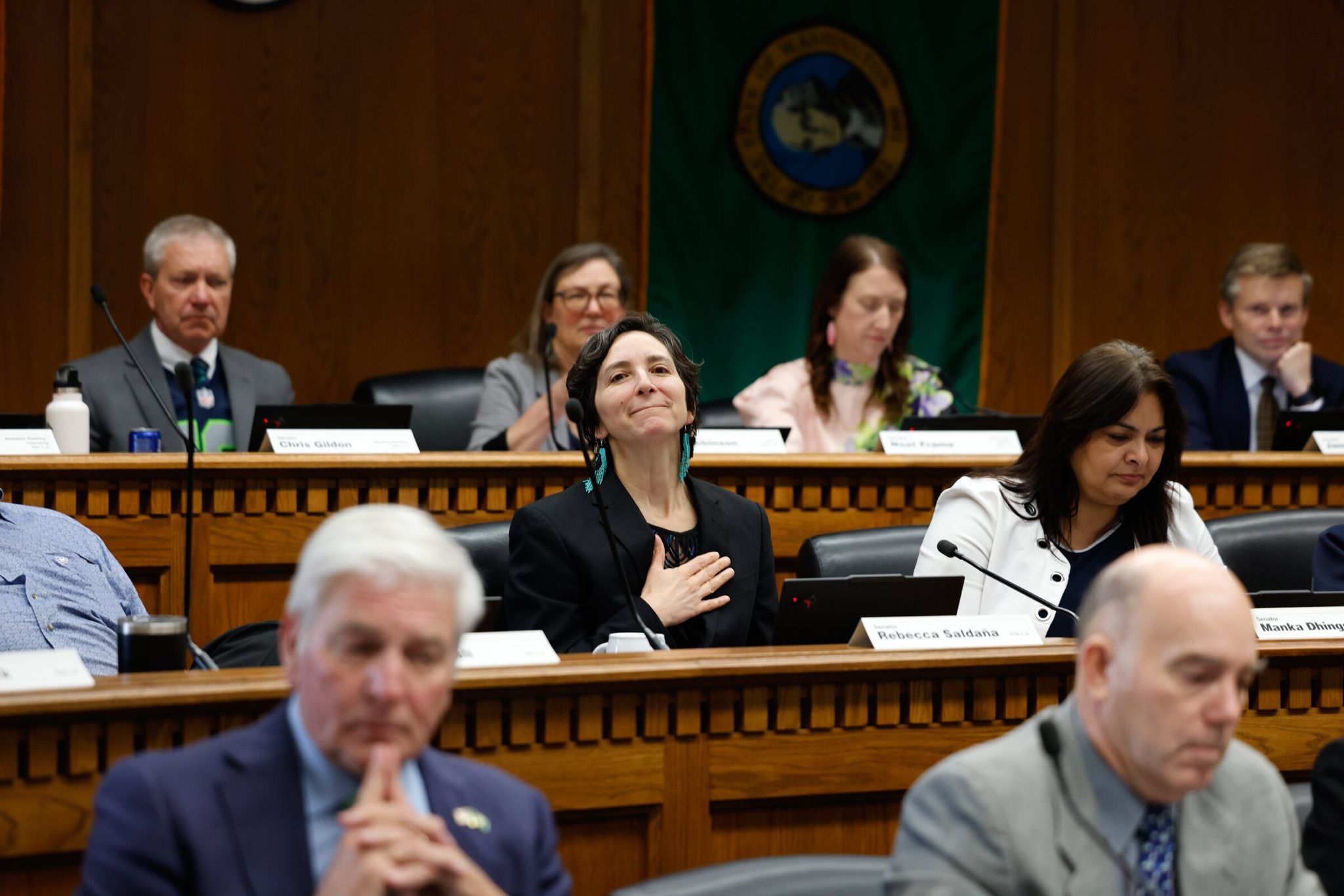 Senator Rebecca Saldaña, center, listens to public testimony on the proposed 'millionaires tax' before the Washington State Senate Committee on Ways and Means in Olympia on Friday. (Karen Ducey / The Seattle Times)
