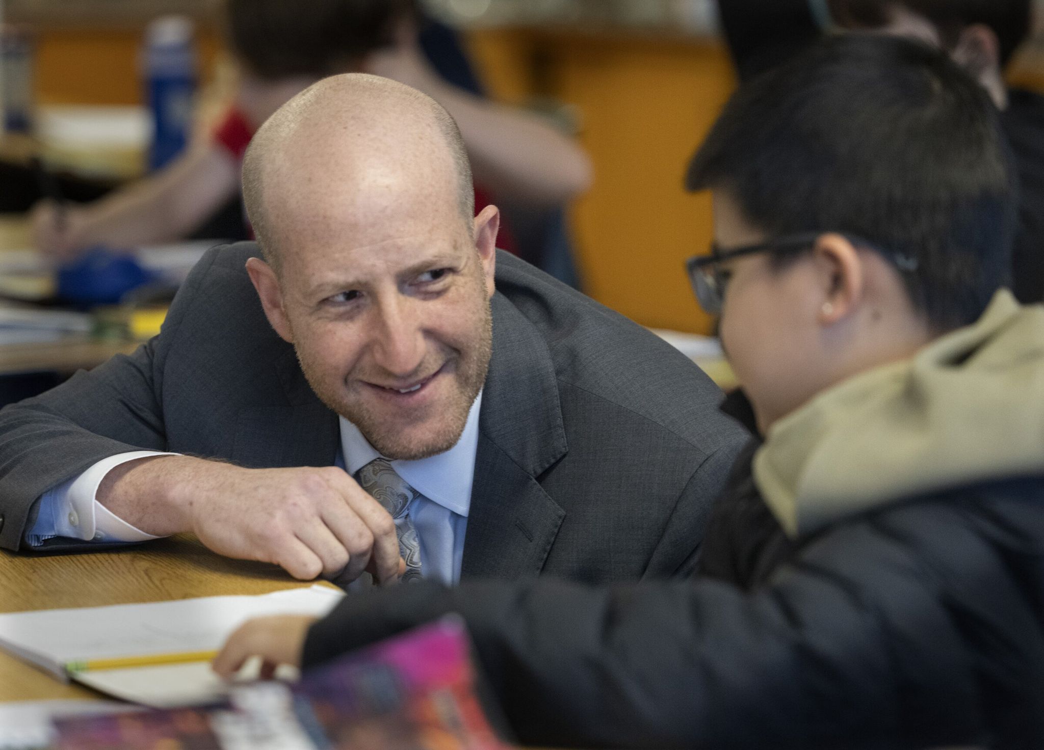 School district leader Ben Schuldtner talks with fourth-grader Suraj Hoi during a tour of Lafayette Elementary on Wednesday. (Ellen M. Banner / The Seattle Times)