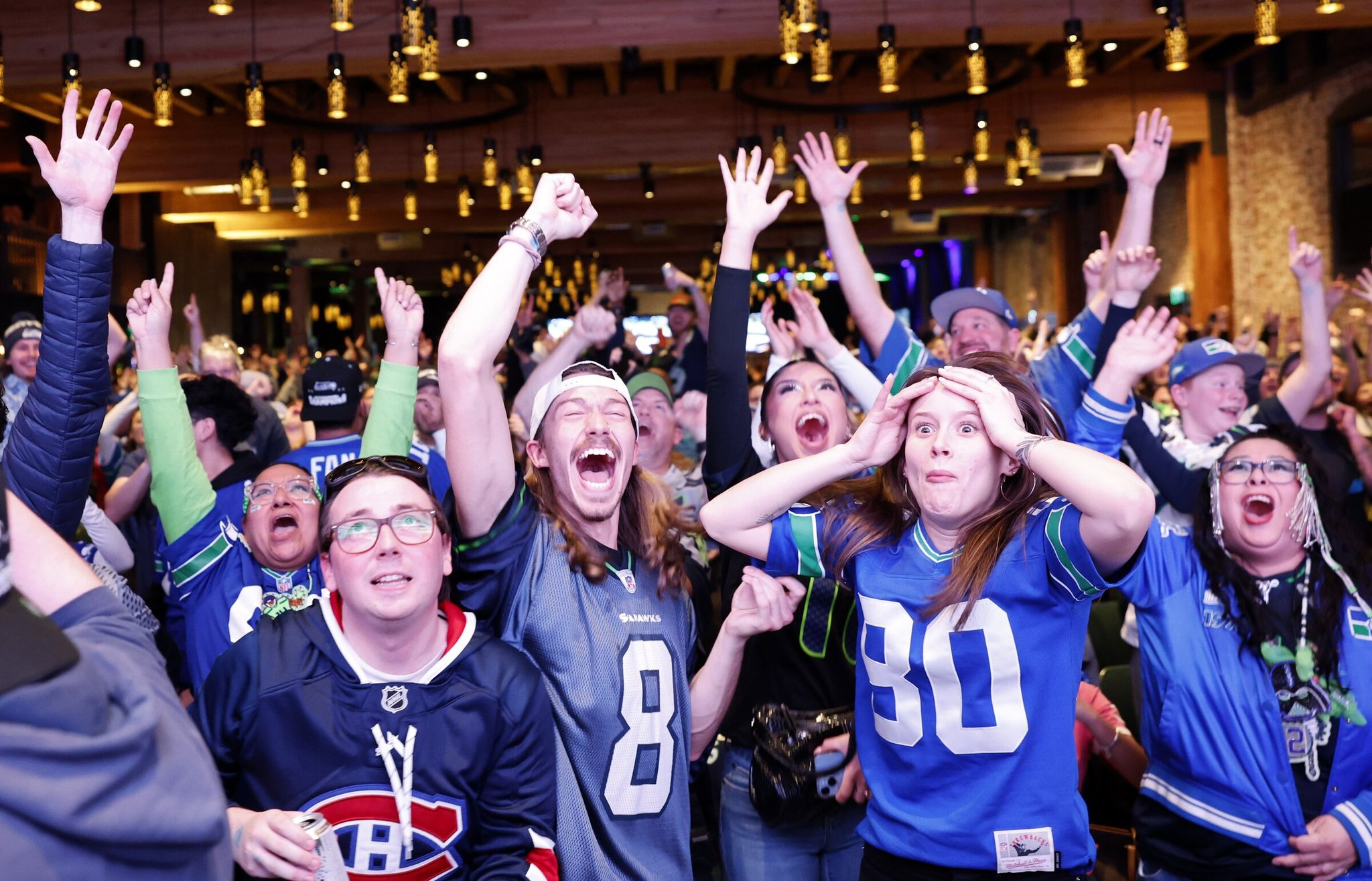Fans react watching the Seahawks game at Super Bowl LX in Victory Hall in Seattle on Sunday, Feb. 8, 2026. (Karen Ducey / The Seattle Times)