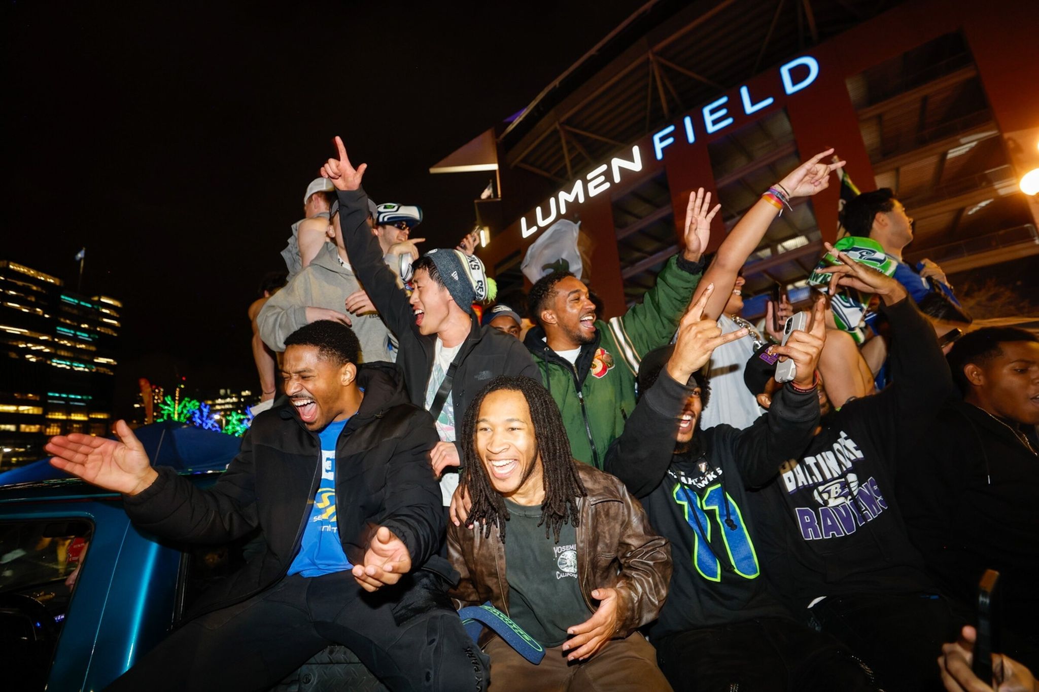Fans celebrate outside Lumen Field after the Seahawks won Super Bowl LX in Seattle on Sunday, Feb. 8, 2026. (Karen Ducey / The Seattle Times)