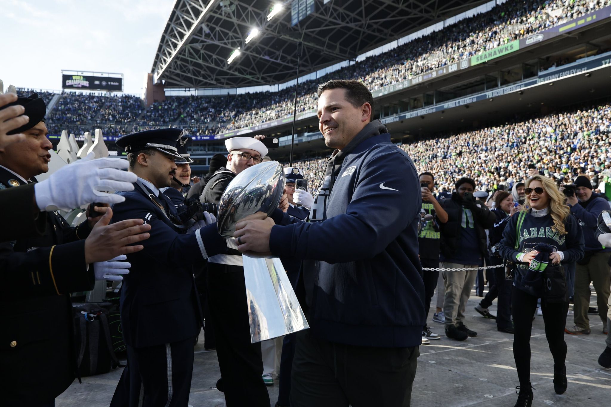 Head coach Mike McDonald arrives with the trophy. The Seattle Seahawks celebrated their Super Bowl 60 win with a trophy presentation at Lumen Field and a downtown Seattle parade on Tuesday, Feb. 11, 2026. (Dean Rutz / The Seattle Times)