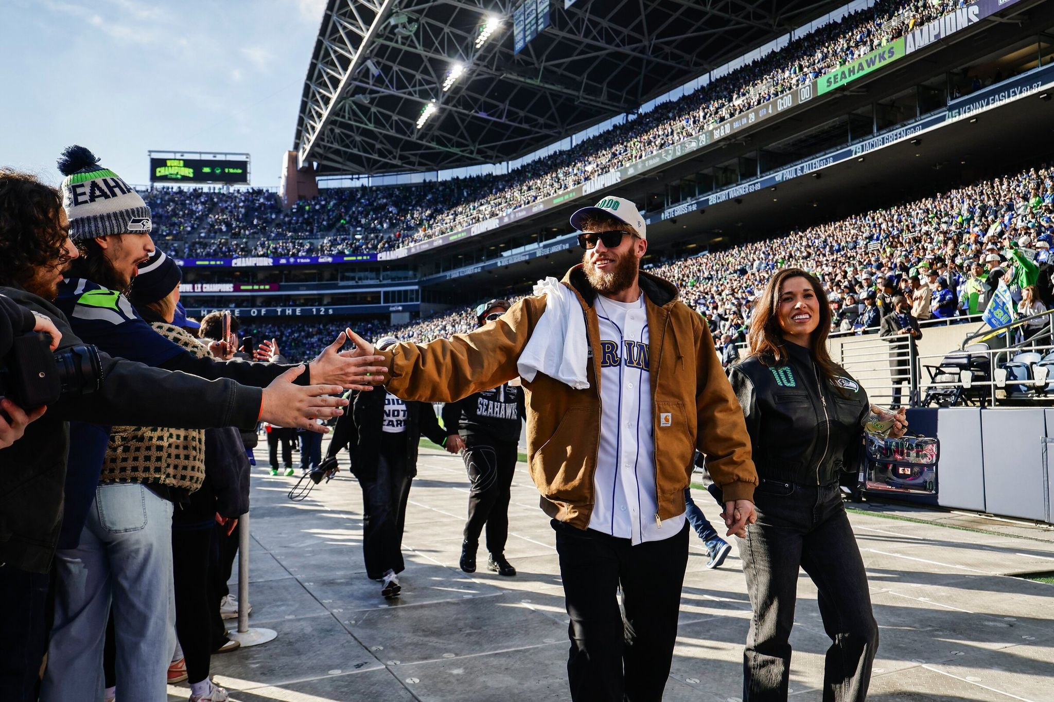 Cooper Kupp greets fans at Lumen Field as the Seattle Seahawks celebrate their Super Bowl 60 win at Lumen Field. (Dean Rutz / The Seattle Times)