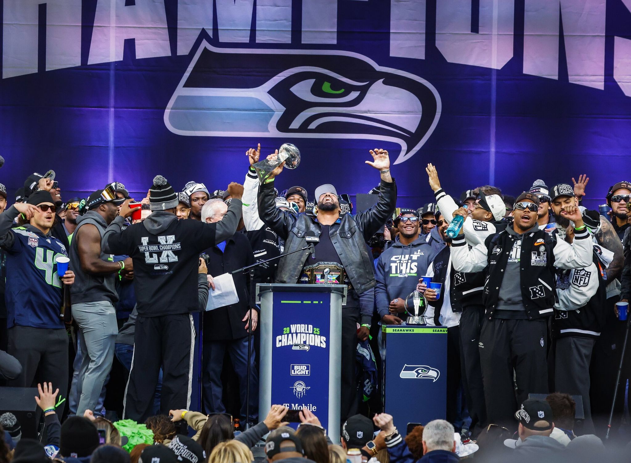 Leonard Williams, a Seahawks defensive lineman, raised his arms as the team celebrated their Super Bowl 60 victory with a trophy ceremony at Lumen Field and a downtown Seattle parade on Tuesday, Feb. 11, 2026. (Dean Rutz / The Seattle Times)