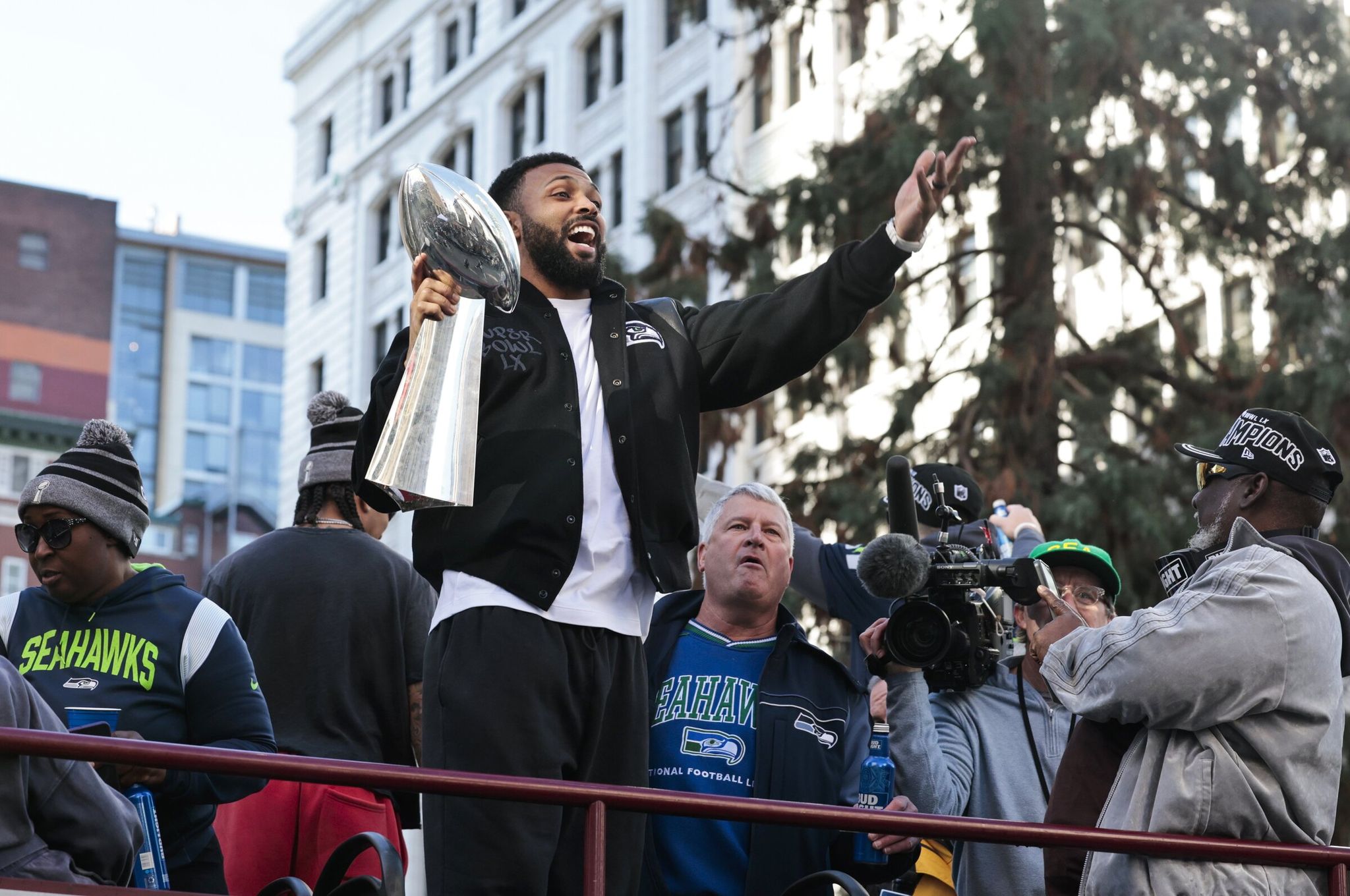 Julian Love holds the Vince Lombardi Trophy during the Seahawks world champions parade in Seattle on Wednesday, Feb. 11, 2026. (Karen Ducey / The Seattle Times)