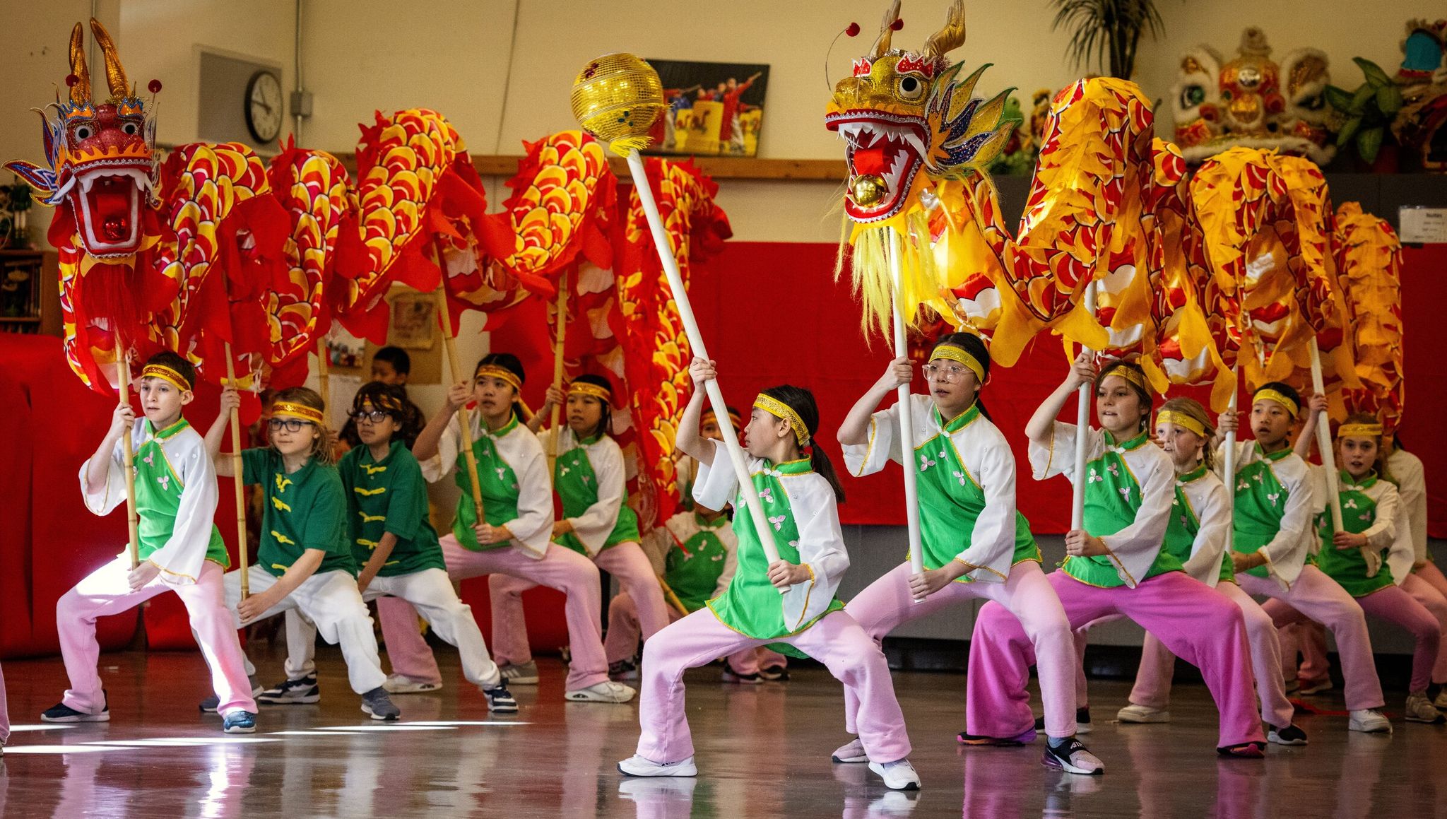 Dearborn Park International Elementary students perform as dragons during the Lunar New Year celebration on Feb. 10. (Ken Lambert / The Seattle Times)