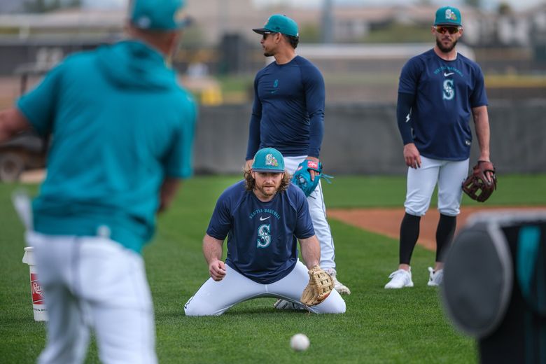 Newly acquired infielder Brendan Donovan works out at third Monday. (Dean Rutz / The Seattle Times)