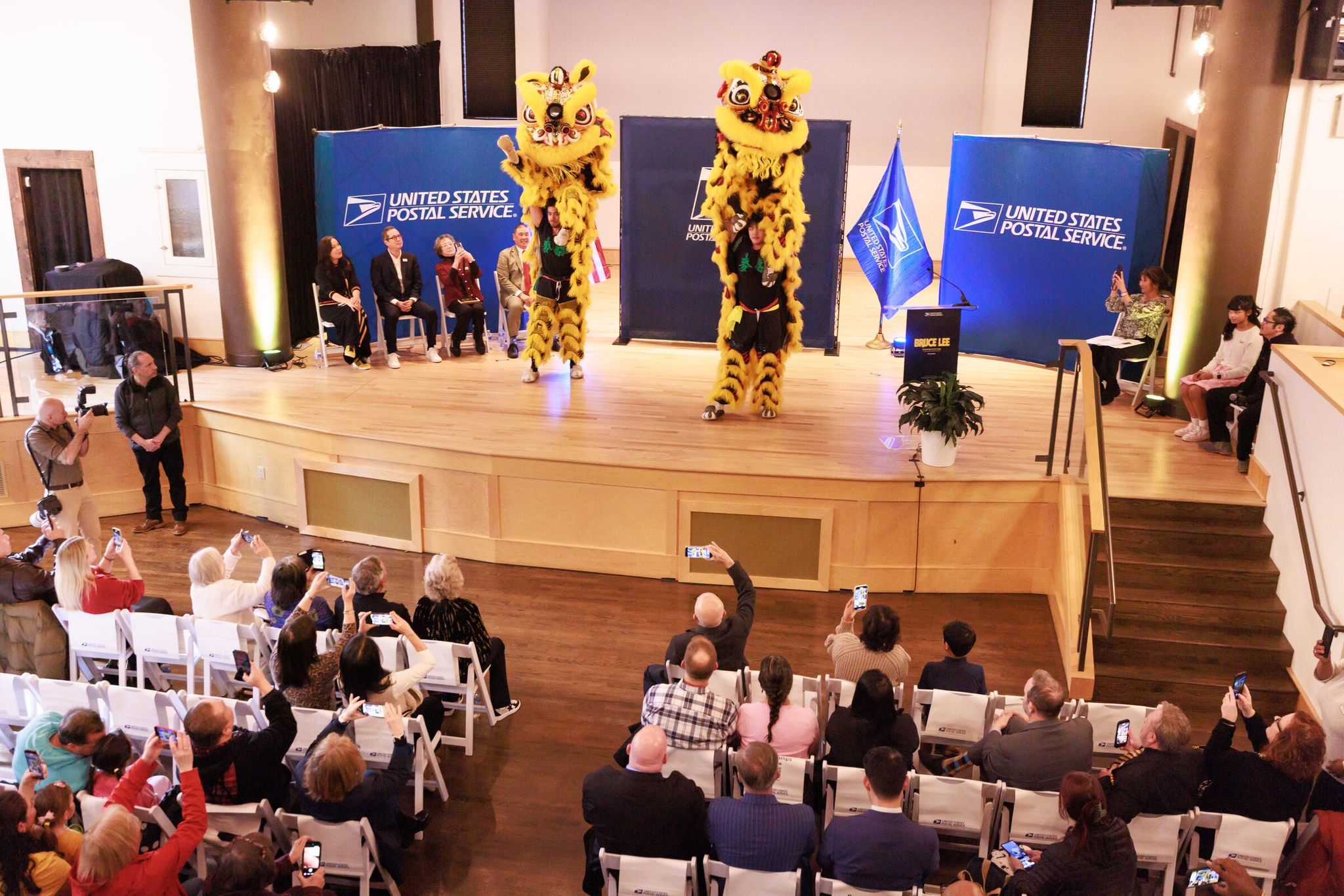 Mak Fai Martial Arts Association and dragon and lion dancers perform at the Bruce Lee Forever first-day-of-issue event on Wednesday at Nippon Kan theater. (Erika Schultz / The Seattle Times)