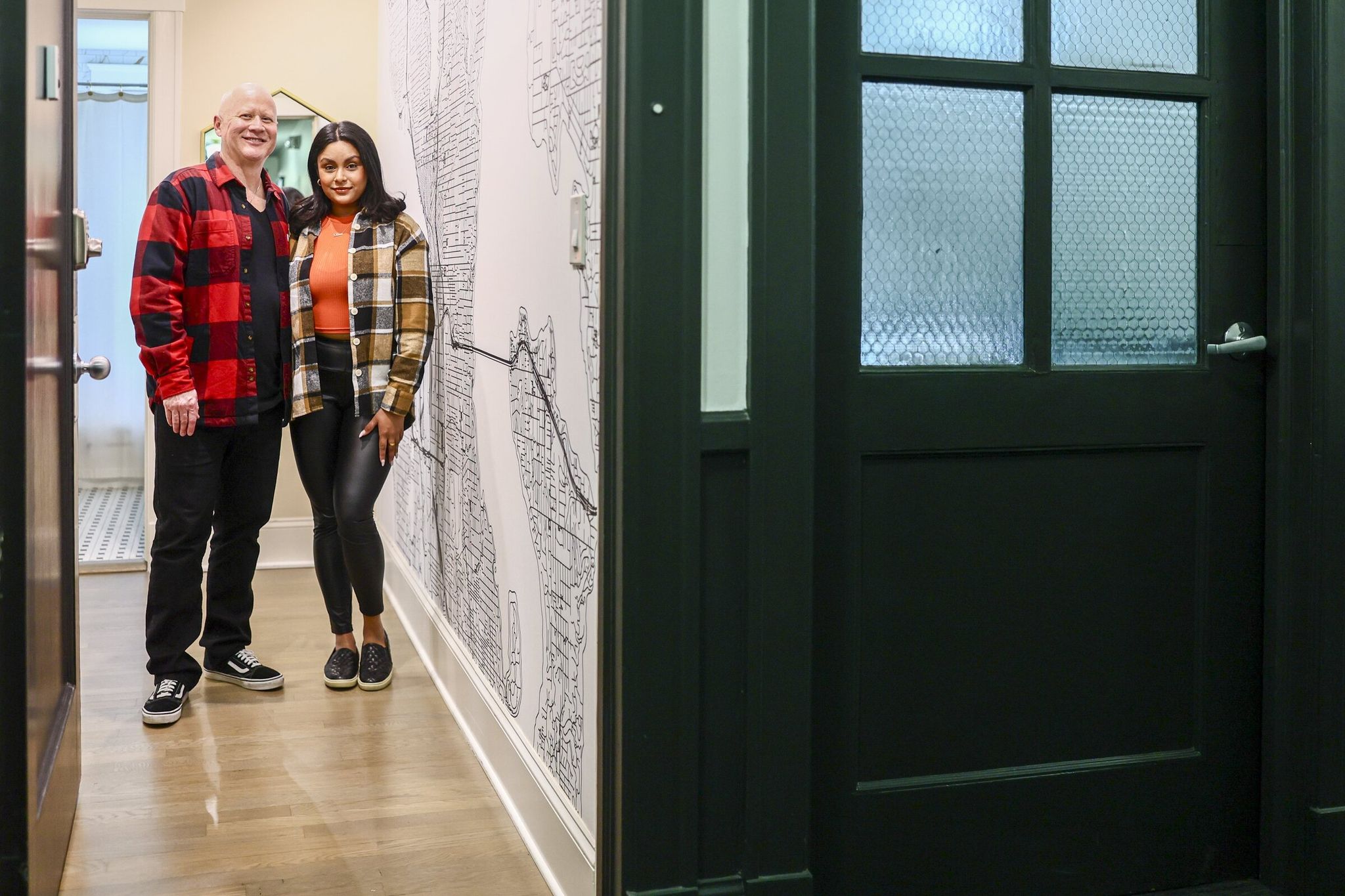 Business partners Christopher John and Nimrata Nand manage an Airbnb in Seattle booked for the World Cup period and into September. (Kevin Clark / The Seattle Times)