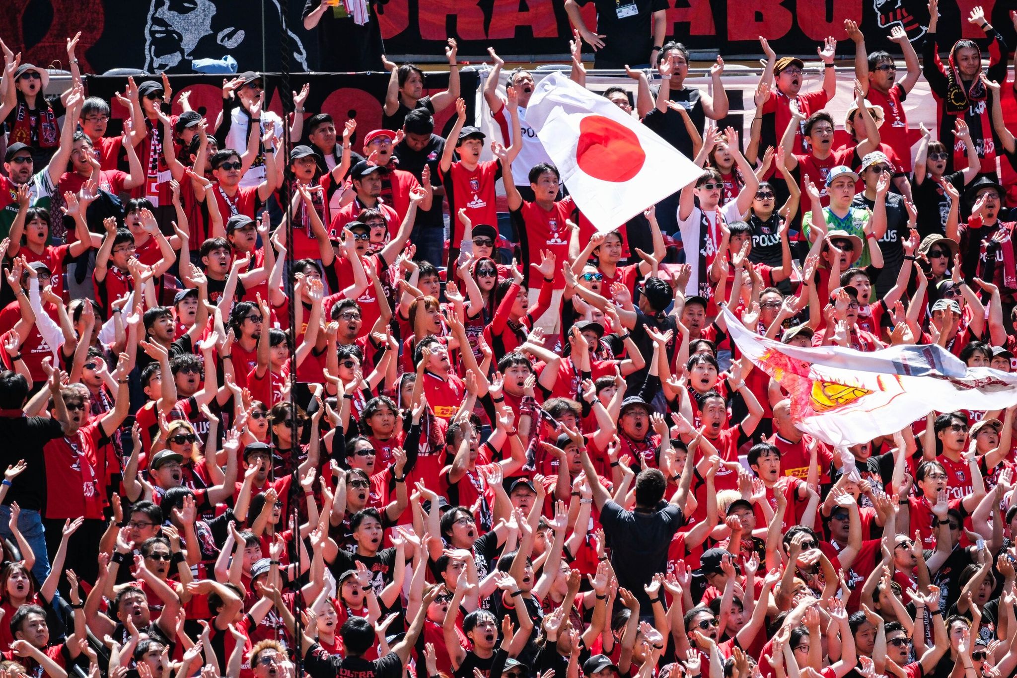 Urawa Red Diamonds fans cheer their team during the Club World Cup match against CA River Plate at Lumen Field last June. (Dean Rutz / The Seattle Times)