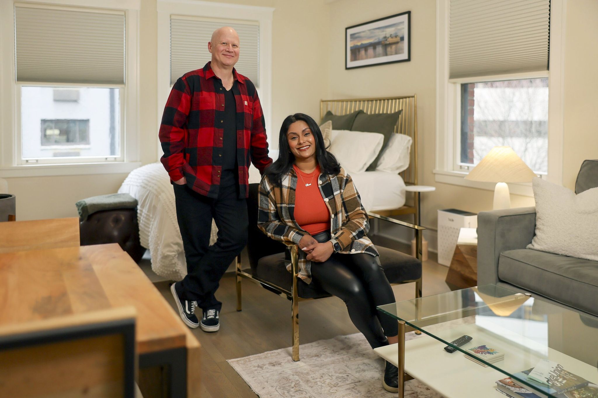 Business partners Christopher John and Nimrata Nand manage an Airbnb apartment in Seattle that is booked for the World Cup period and beyond — through September. Photographed on Friday. (Kevin Clark / The Seattle Times)