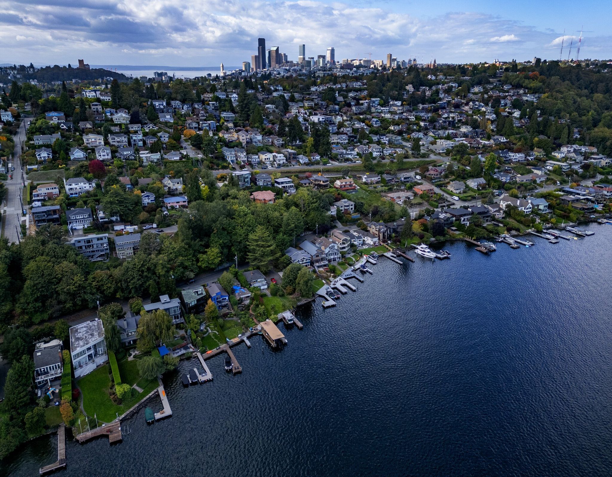 Single-family homes in the Leschi neighborhood stretching from Lake Washington, photographed from the air, with downtown Seattle in the background, Wednesday, Oct. 2, 2024. (Ken Lambert / The Seattle Times, 2024)