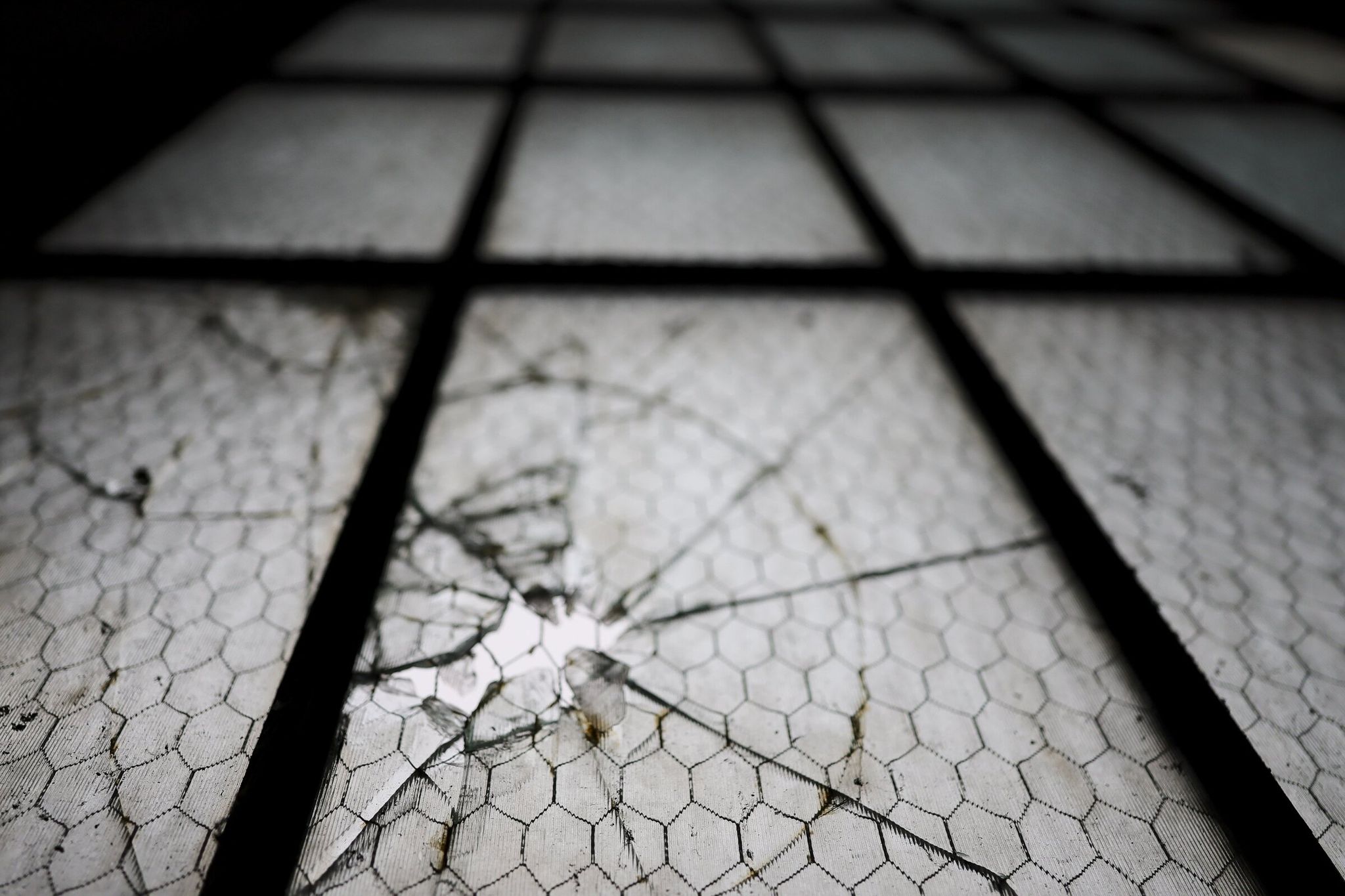 A cracked window at Building 2 in Magnuson Park in Seattle on Jan. 29, 2026. (Kevin Clark / The Seattle Times)