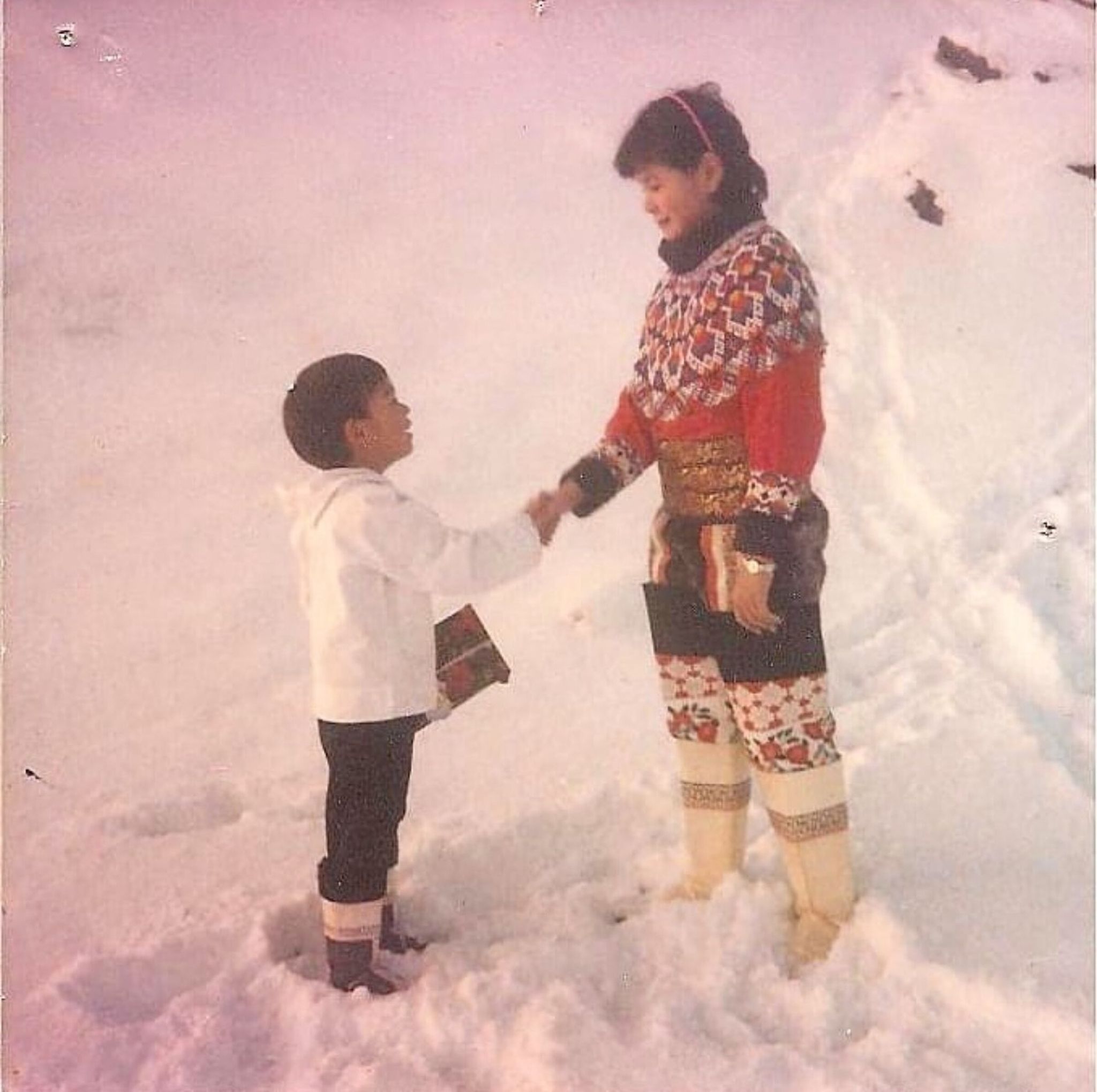 Simon Linge shaking hands with his godmother at his brother’s baptism in Alluitsup (Alluitsup), southern Greenland. (Provided by Simon Linge)