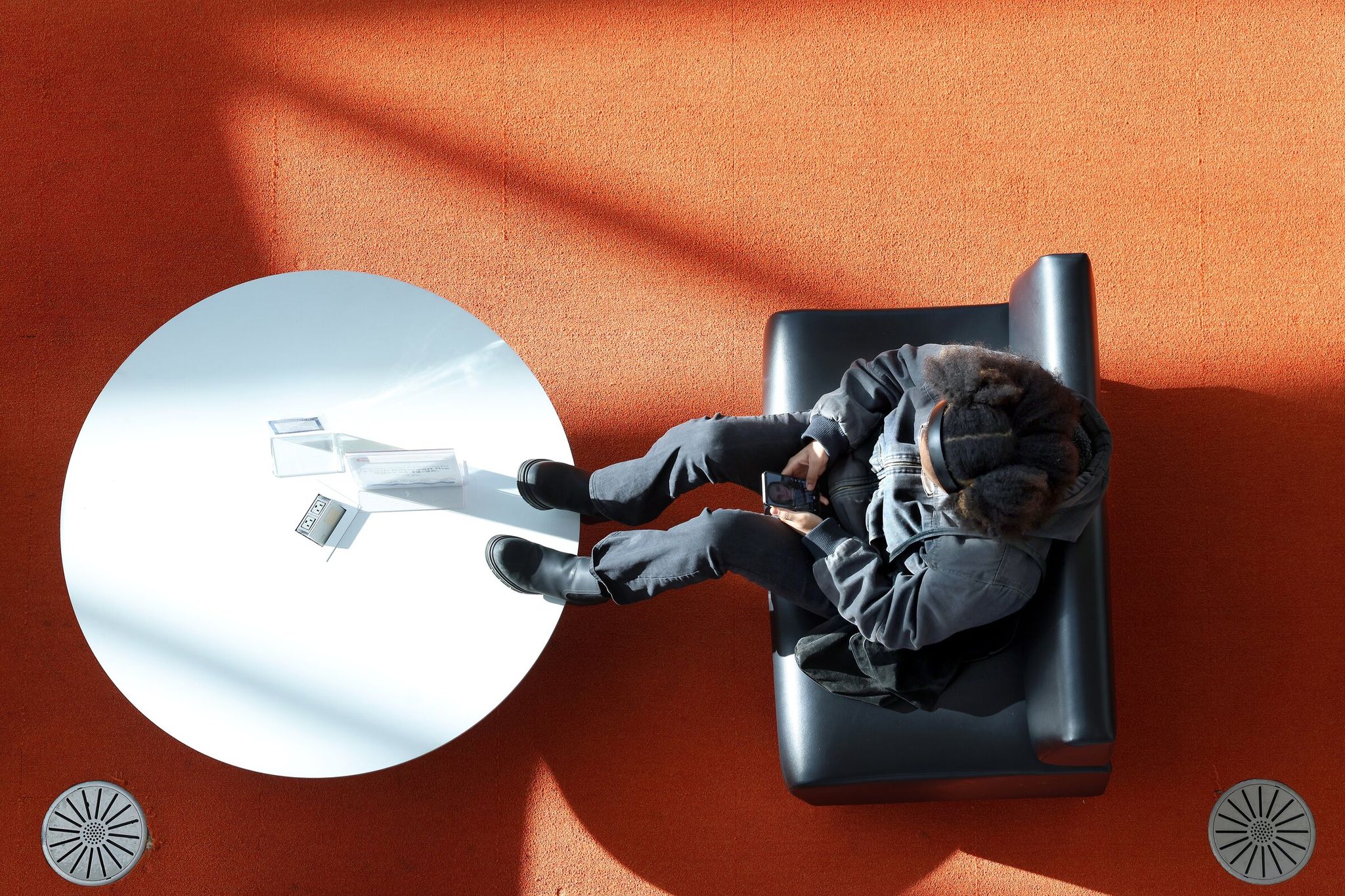 A visitor to the Seattle Central Library spends time on the second floor in January. (Ellen M. Banner / The Seattle Times)