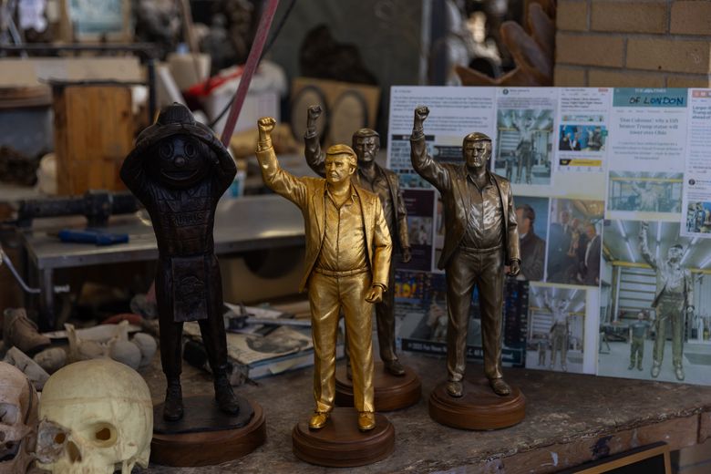 Miniature versions of the Trump statue, designed by Alan Cottrill, in his studio in Zanesville, Ohio, Jan. 29. At 15 feet tall, the statue of President Donald Trump, mounted on its 7,000-pound pedestal, is about the height of a two-story building — a giant effigy cast in bronze and finished with a thick layer of gold leaf. (Maddie McGarvey/The New York Times)