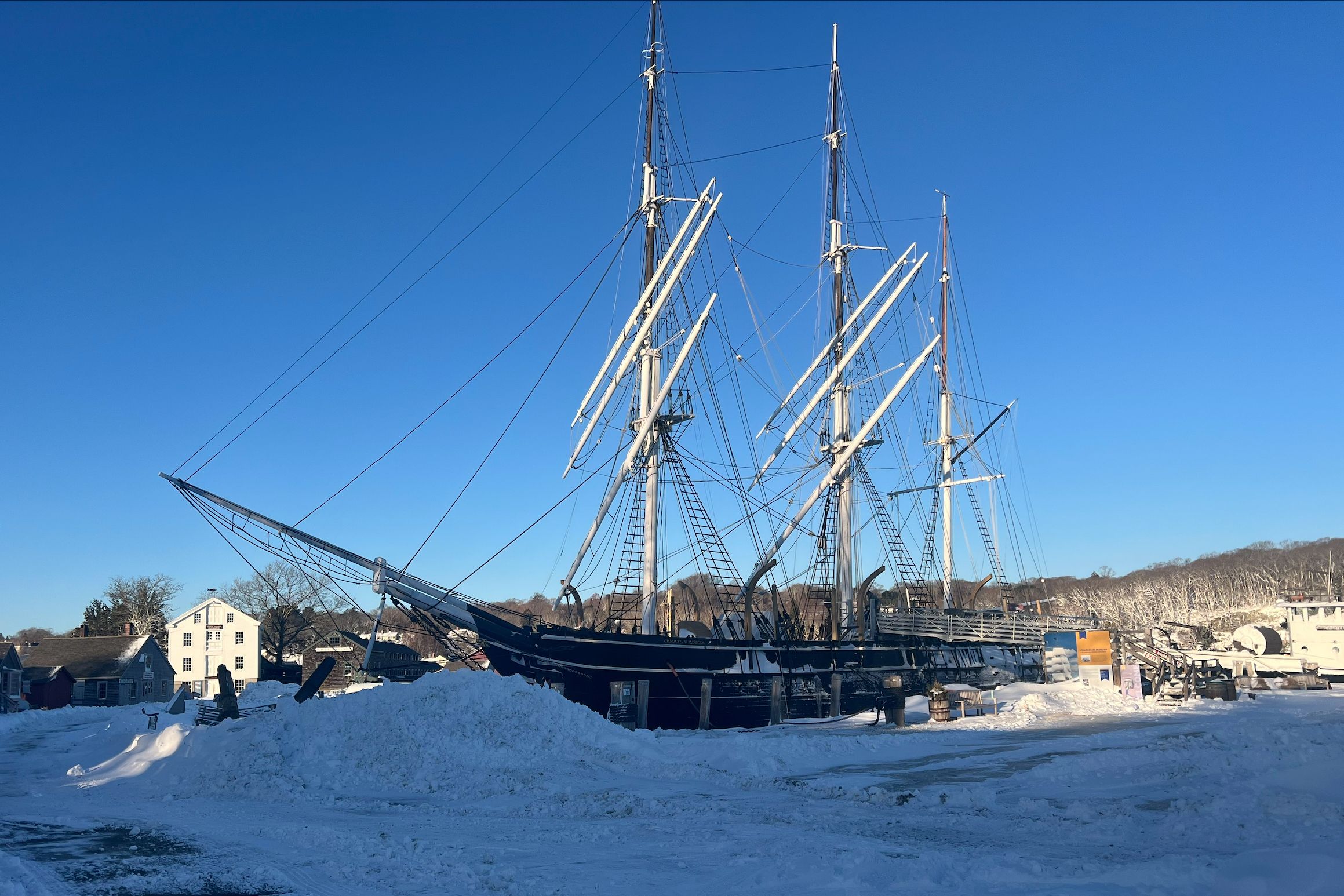 With rubber shovels and grit, Mystic Seaport workers dig out