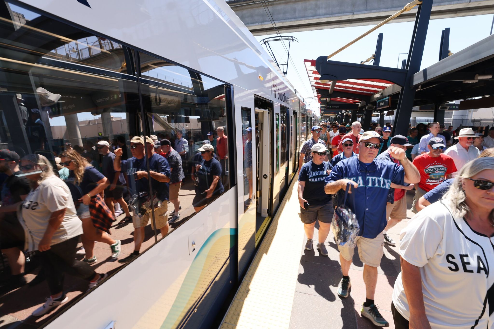Light-rail passengers exiting at Stadium station in Seattle. This area will be especially busy this summer when World Cup matches come to the city. (Karen Ducey / The Seattle Times, 2023)