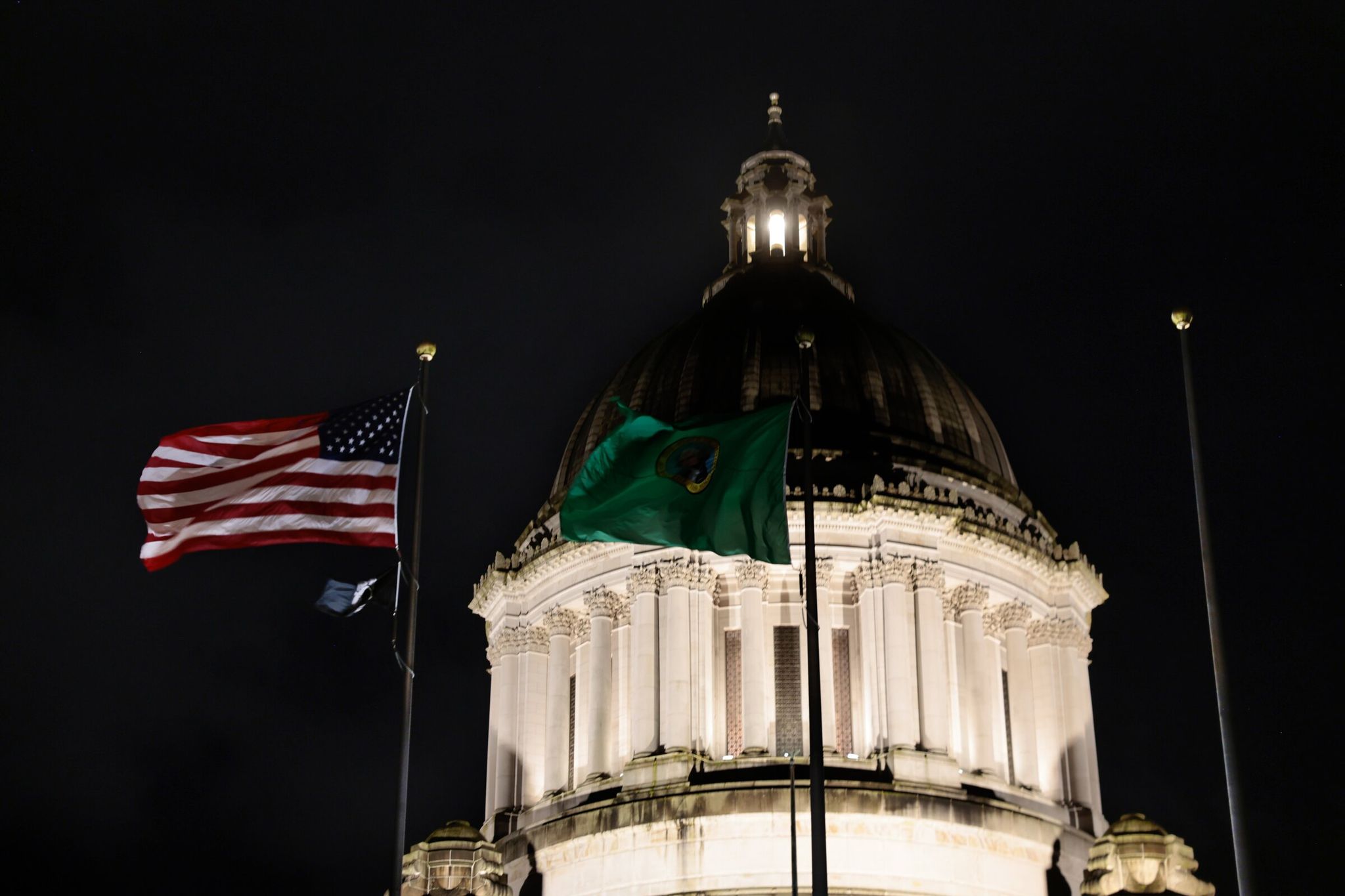 The Legislative Building is lit up Tuesday night at the state capitol in Olympia. (Karen Ducey / The Seattle Times)