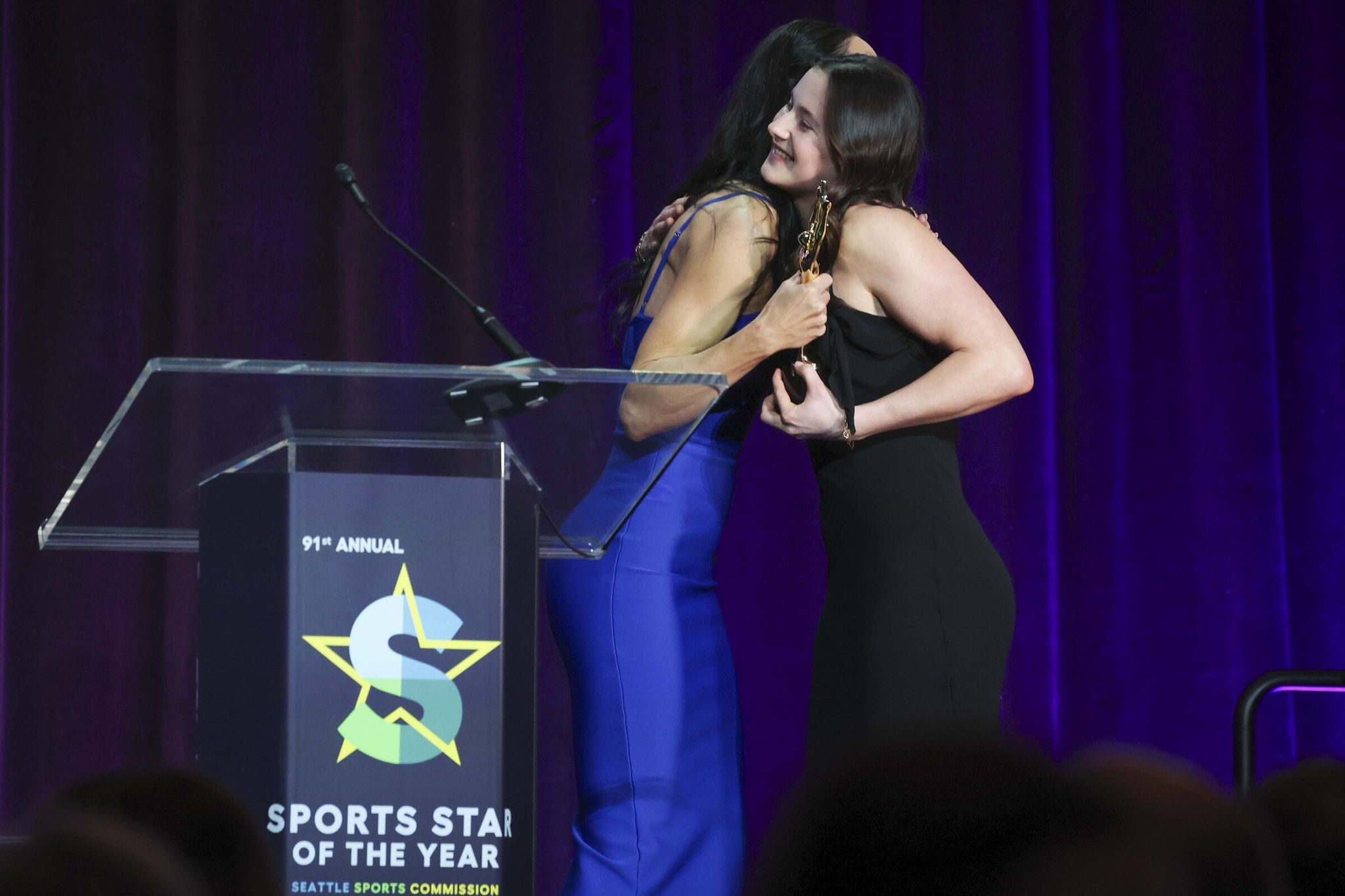 UW Track and Field, Pole Vault record breaker Amanda Moll walks off stage upon accepts Sports Star of the Year in women’s sports award during the 91st annual Sports Star of the Year Awards show at the Seattle Convention Center Summit in downtown Seattle on Friday, March 13, 2026. (Ivy Ceballo / The Seattle Times)