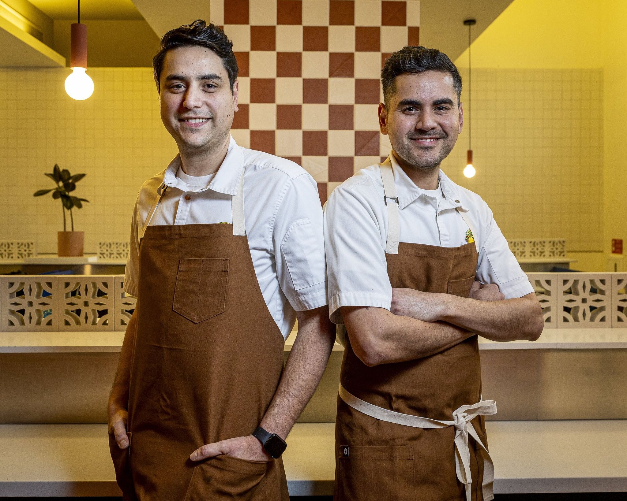 Rey Gastelum (left) and Osiel Gastelum — brothers and creators of Tacos Cometa. (Kevin Clark / The Seattle Times)