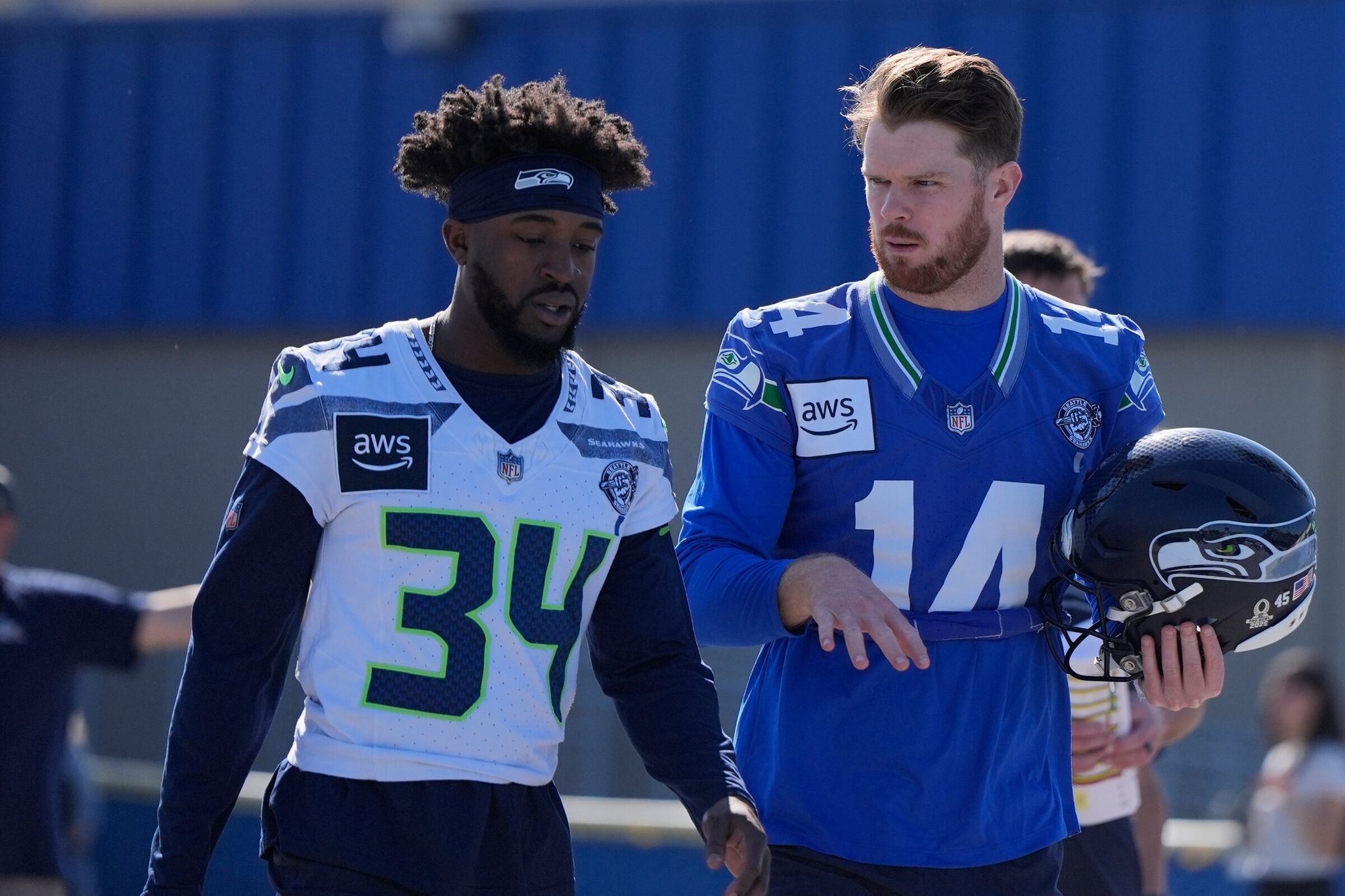Seattle Seahawks quarterback Sam Darnold (14) and Shemar Jean-Charles arrive to practice on Friday, Feb. 6, 2026, in San Jose, Calif., ahead of Super Bowl 60 between the New England Patriots and the Seattle Seahawks. (Brynn Anderson / The Associated Press)