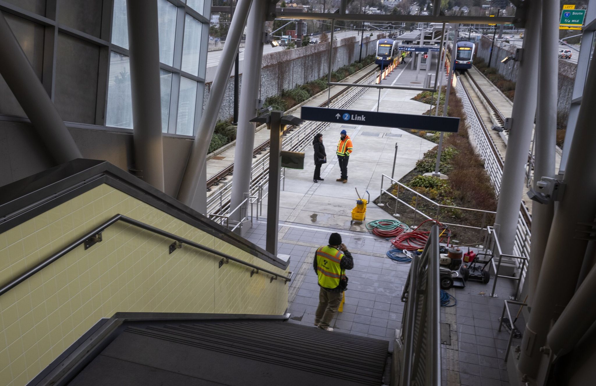 Judkins Park station in Seattle, shown here during training runs of two trains, has an upper-level entrance at 23rd Avenue South and a lower-level entrance at Rainier Avenue South. (Ellen M. Banner / The Seattle Times)