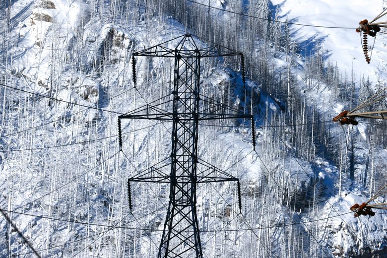 High-voltage transmission lines are seen from Newhalem, Whatcom County, in the foothills of the North Cascades. In recent years, utilities across the state — including Seattle City Light, PSE, Snohomish County PUD and Tacoma Power — have introduced one or more “demand response” programs to incentivize customers to shift their electricity use by a few hours. (Karen Ducey / The Seattle Times, 2024)