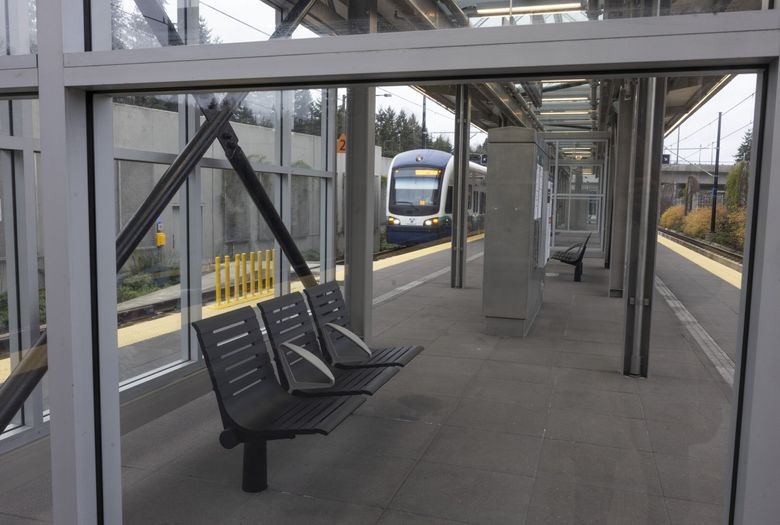 A light rail train on a test run heads east through Mercer Island Station, which is on the 2 Line. (Ellen M. Banner / The Seattle Times)