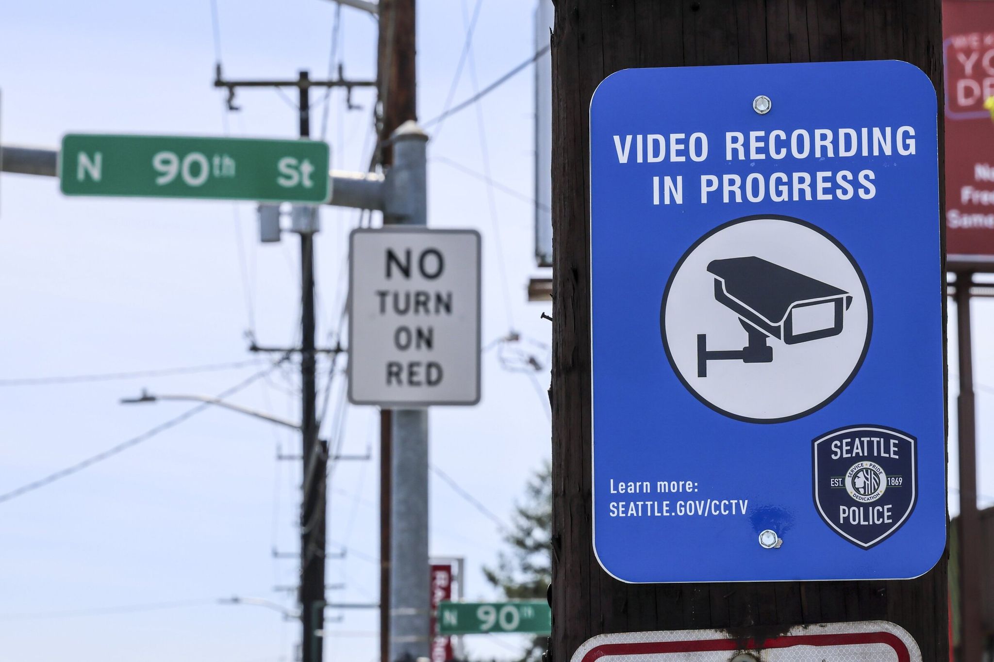 Signs warning of video recording are posted at locations with surveillance cameras in Seattle. Mayor Katie Wilson said Thursday she is pausing planned additions to the police surveillance camera system over concerns they could be used to target immigrants, with the exception of areas near stadiums ahead of the World Cup. (Kevin Clark / The Seattle Times)
