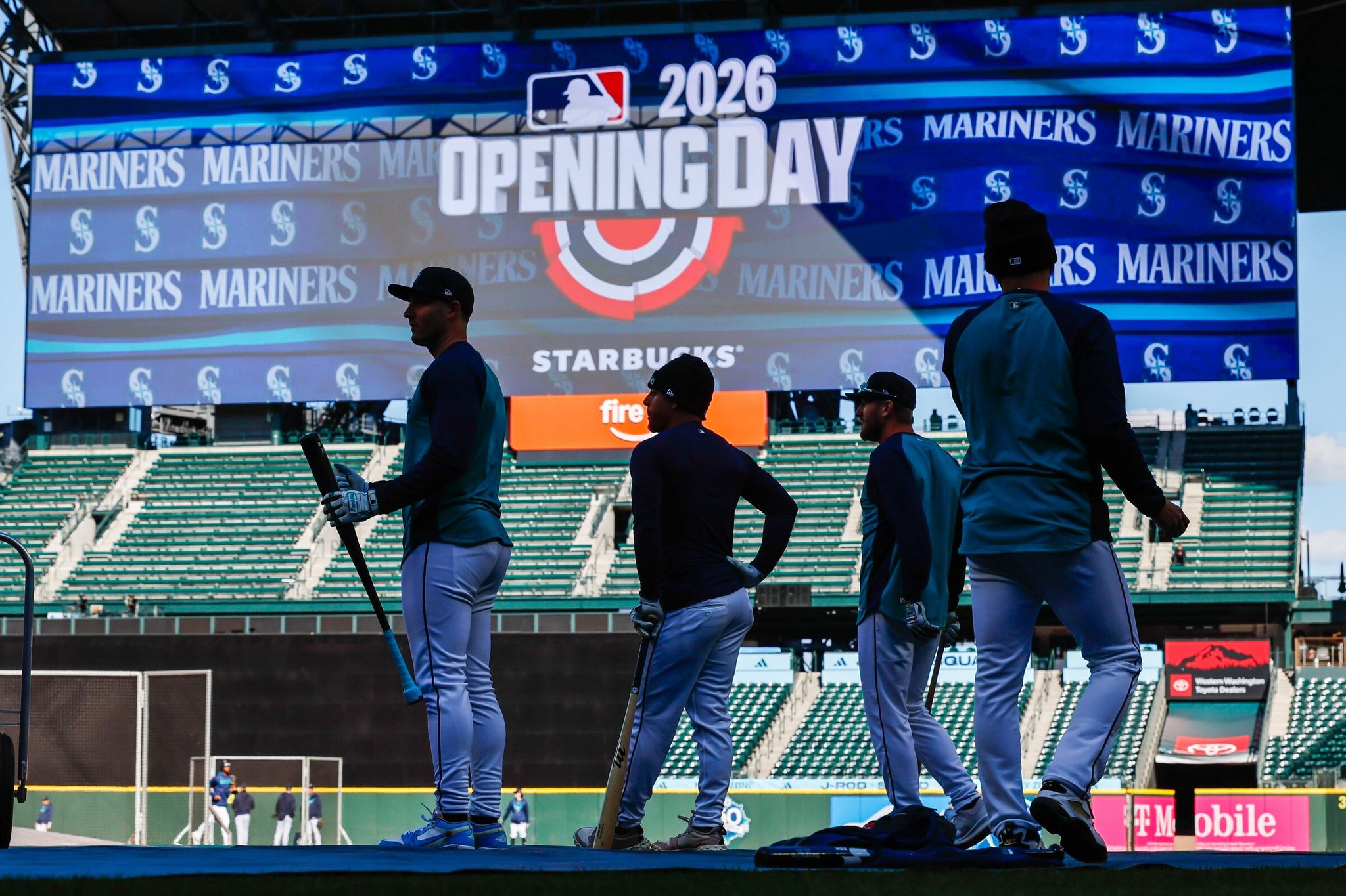 Designated hitter for the Seattle Mariners Dominic Canzone, shortstop Leo Rivas and right fielder Luke Raley take batting practice on Thursday, March 23, 2026, in Seattle. (Jennifer Buchanan / The Seattle Times)